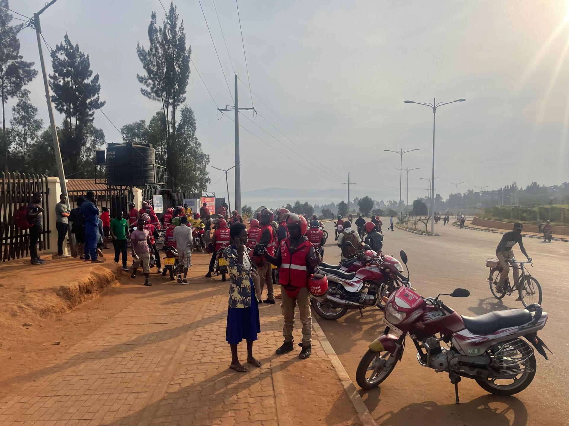 Motorcycles line up to drop off and pick up passengers in Kigali, Rwanda. 