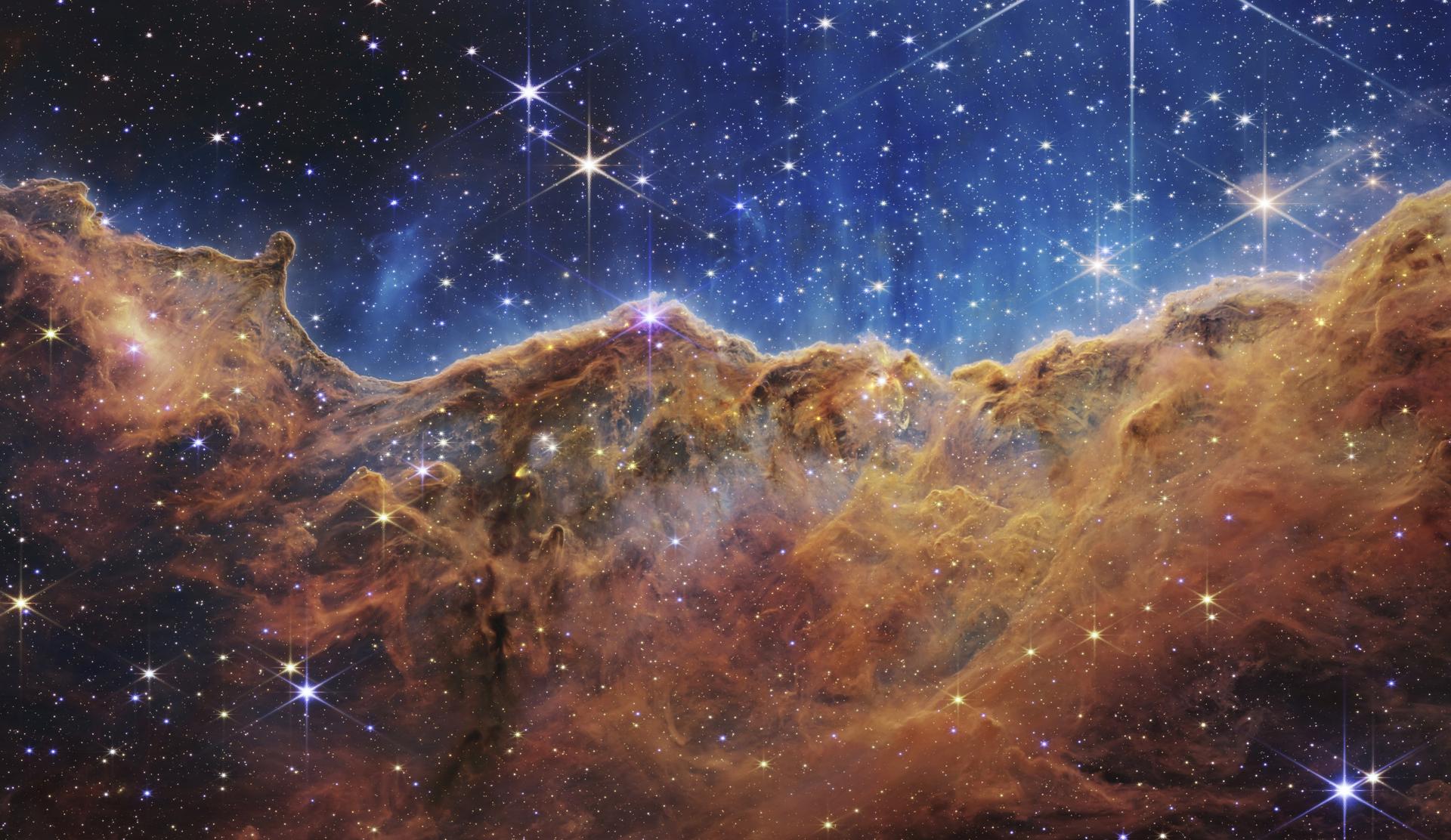 This image shows the edge of a nearby, young, star-forming region NGC 3324 in the Carina Nebula