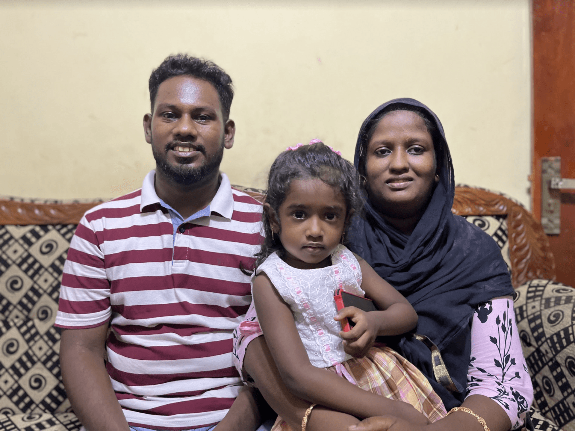 Mohammed Safry and Fathima Rukaiya, with their daughter Sara Safry, at their home in the suburbs of Colombo, Sri Lanka.