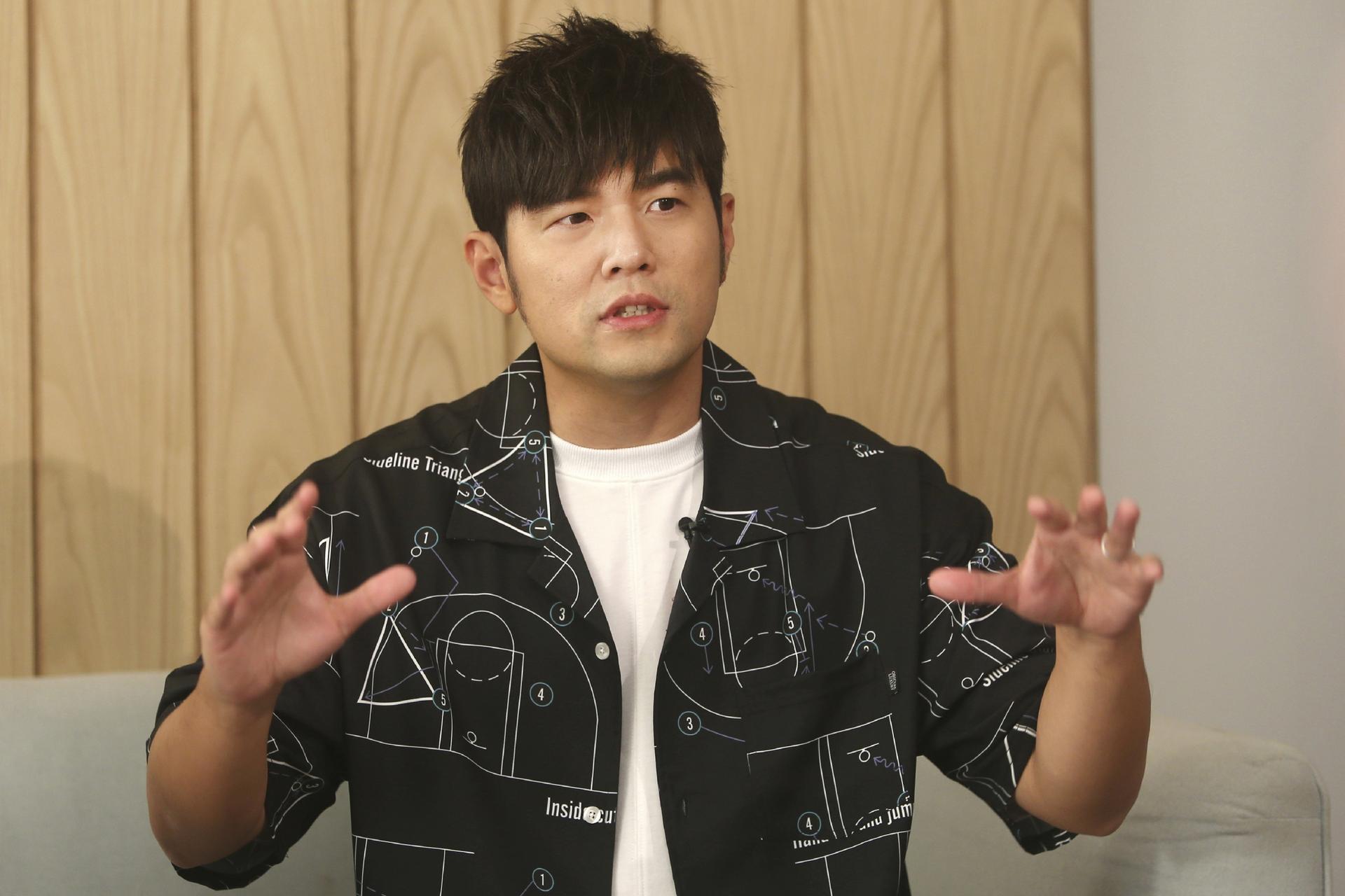 Mandopop superstar Jay Chou gestures while talking about his latest Netflix show "J-Style Trip" and life with his children during an interview, Taipei, Taiwan