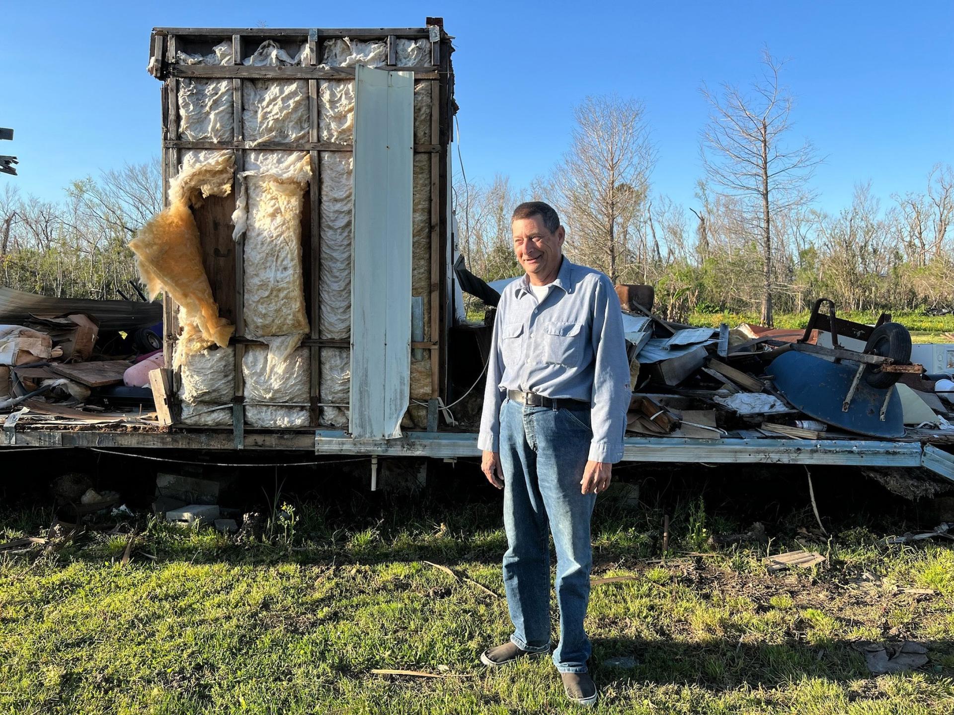 Alces Adams in front of what is left of his trailer, Cut Off, Louisiana. 