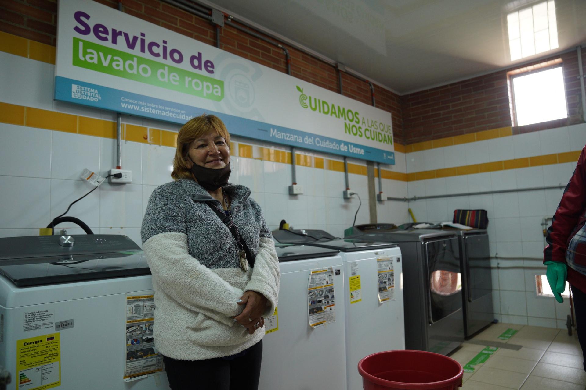 Marlovia Gutierrez takes her laundry every week to a free laundromat at a careblock in the suburb of Usme. Previously she was washing by hand. 