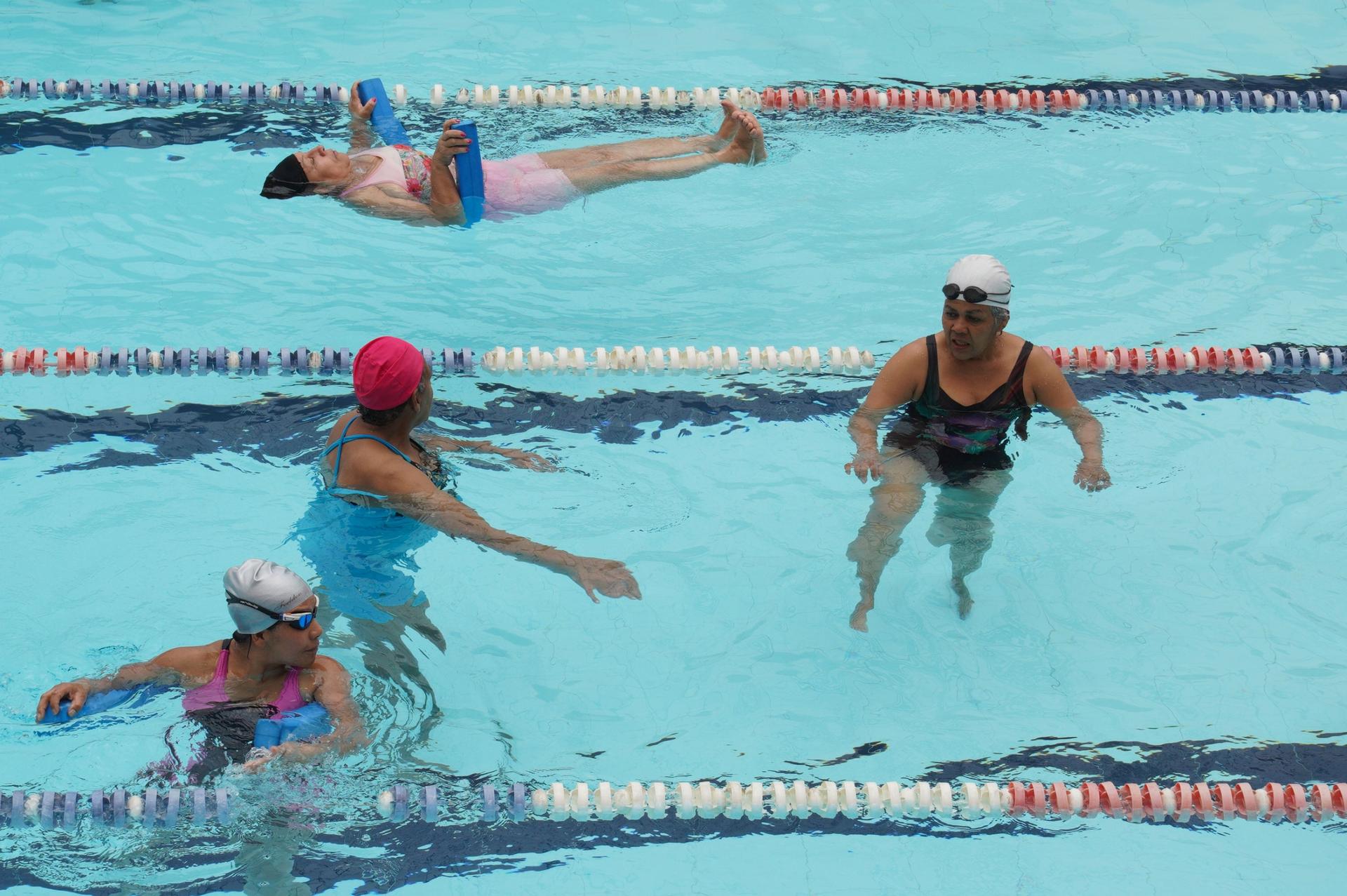 While their laundry is being washed and the kids are taken care of women can participate in different activities at Bogotá's careblocks, including swimming lessons.