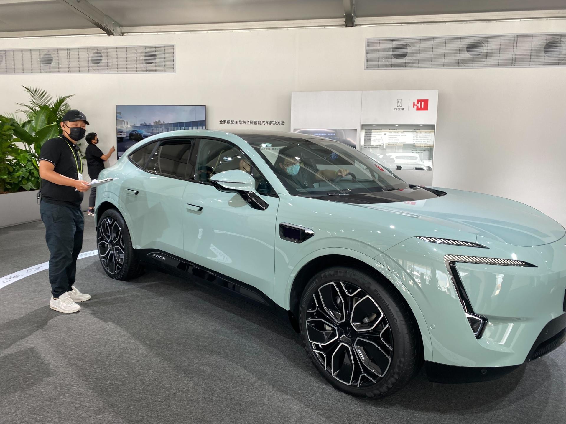 Car buyers check out the Avatr 11 electric vehicle in China.