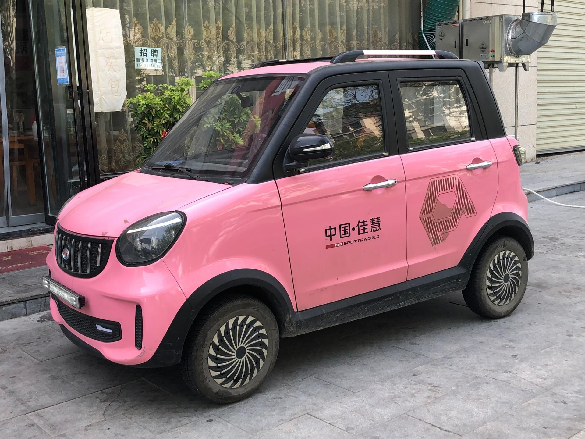 A mini-electric vehicle parked in the street, Zhumadian, China
