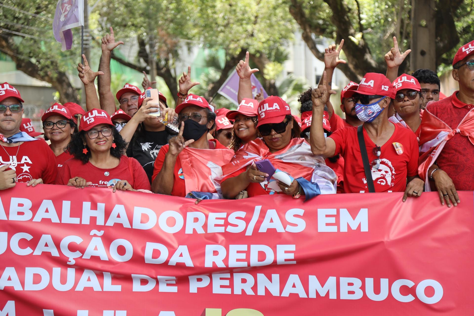 Lula supporters hold a banner
