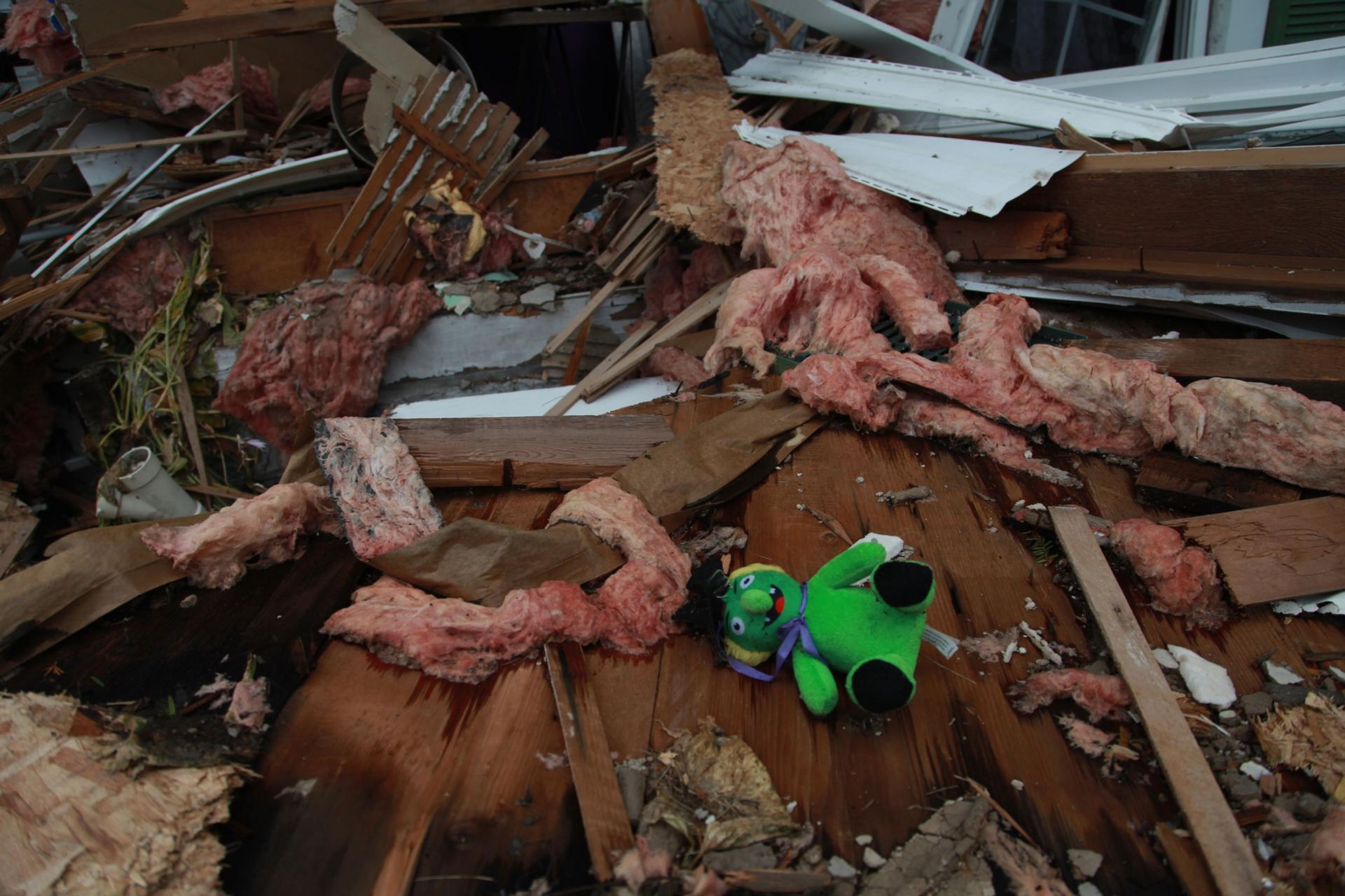 Toys, photos, and personal letters were scattered amid the wreckage of the demolished property — indicating that the house was in use. 