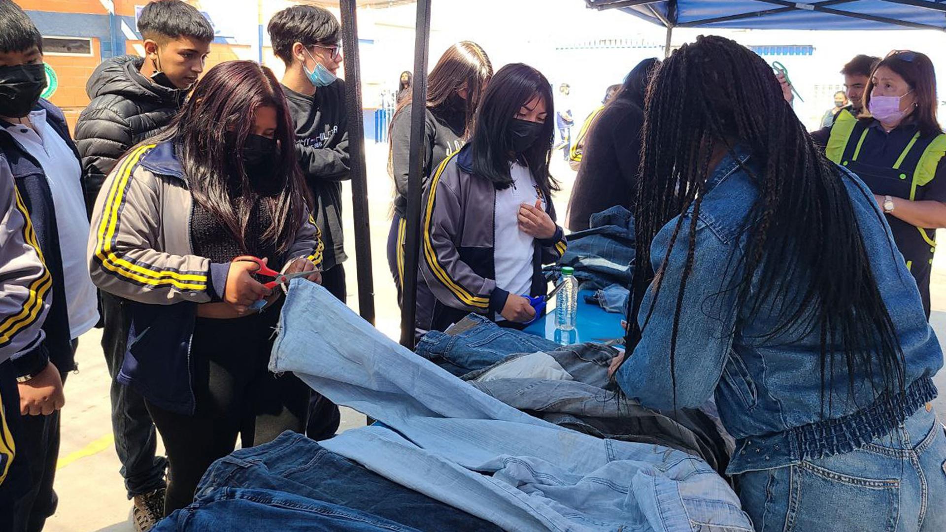 Activist Angela Astudillos teaches a group of children how to recycle at Escuela Nirvana in Alto Hospicio, Chile.
