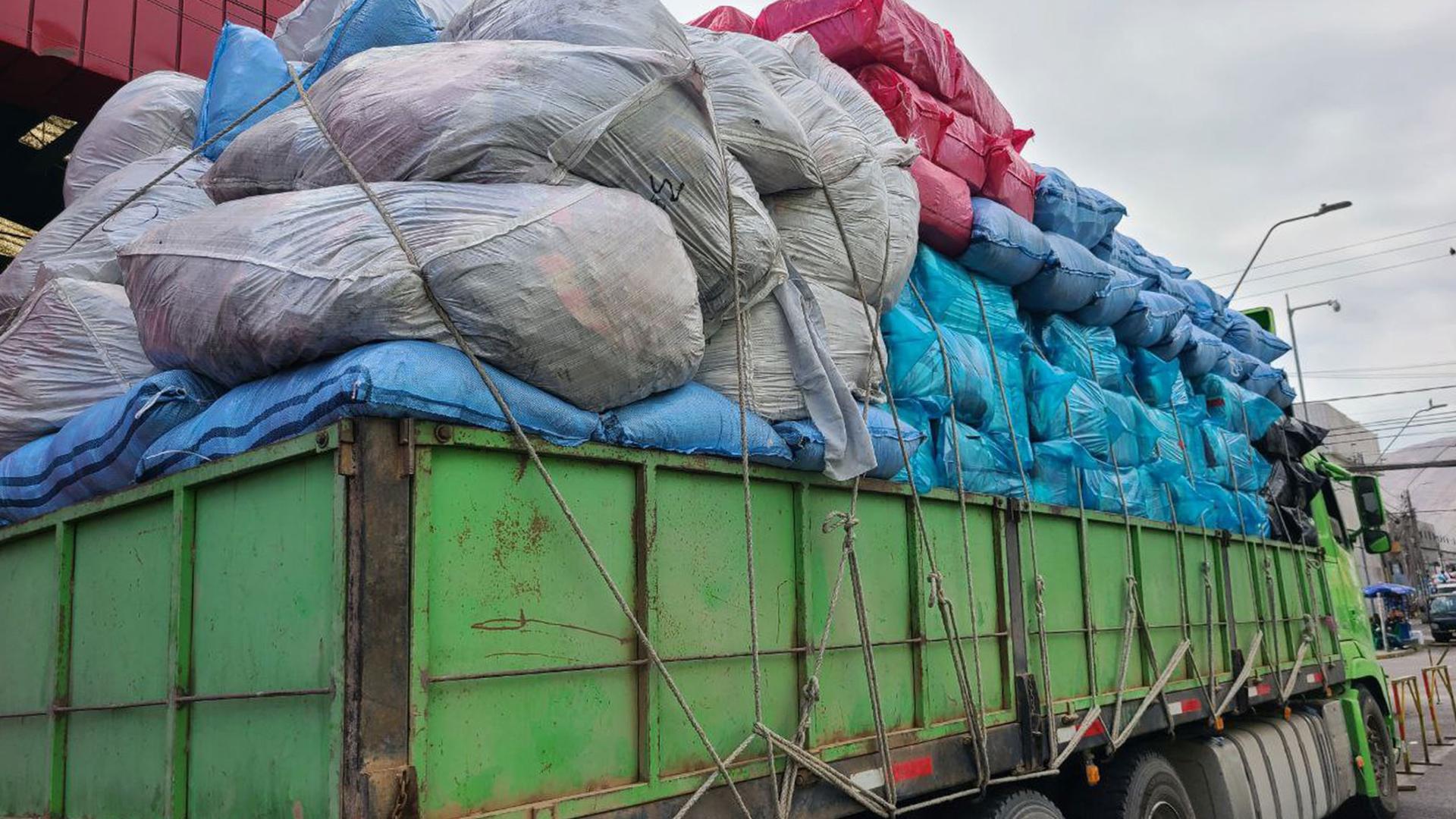 Hundreds of packages of clothes, known as "fardos", arrive every day at Iquique Port, Chile.