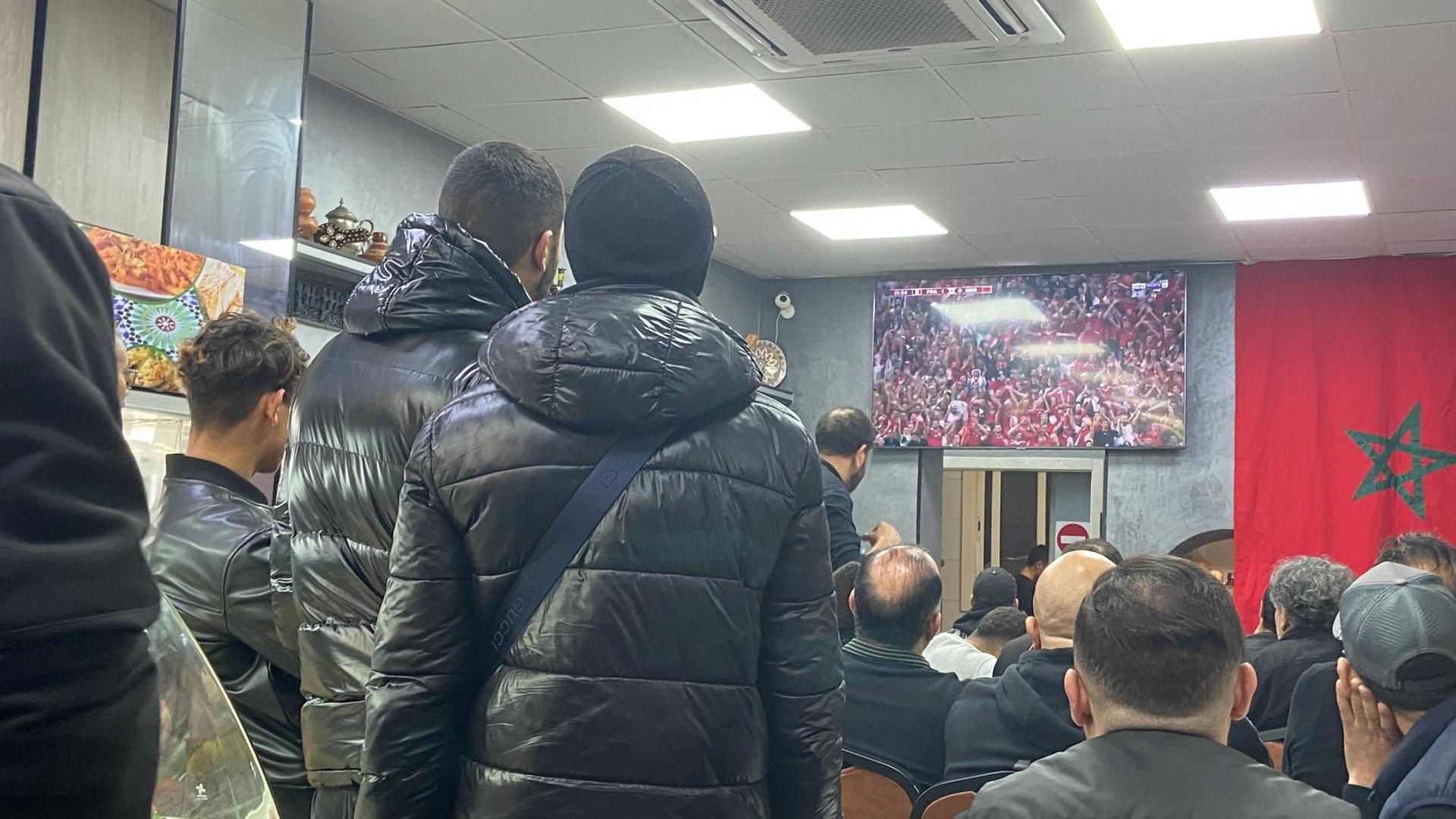 In a Moroccan restaurant in Barcelona, Arab fans with origins across Africa came together to cheer on the Atlas Lions. Viewers said politics often divides nations but sports bring people together.  