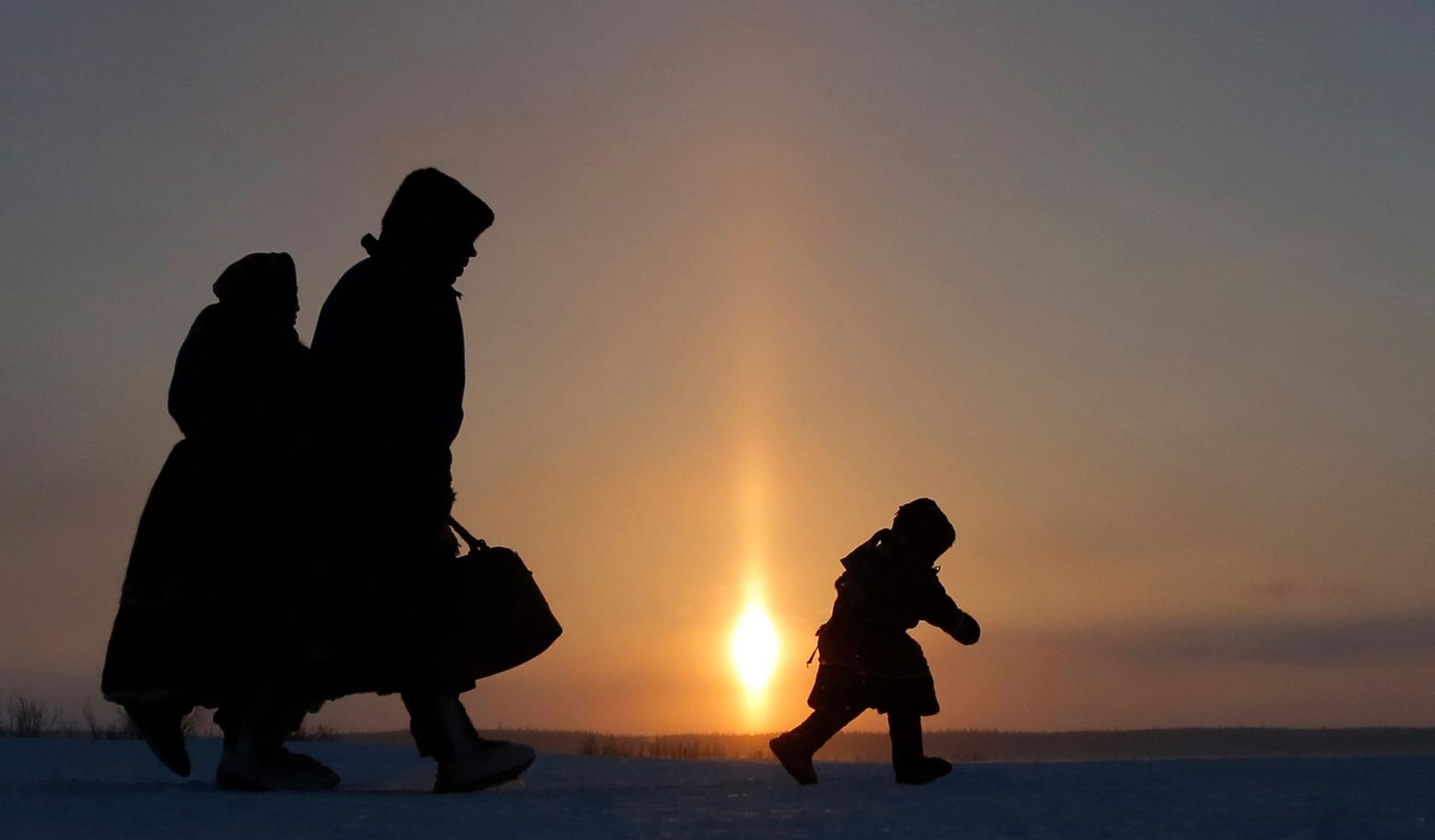 In this photo taken on Sunday, March 15, 2015, a Nenets family in the city of Nadym, in northern Siberia, Yamal-Nenets Region, about 1,553 miles northeast of Moscow, Russia.