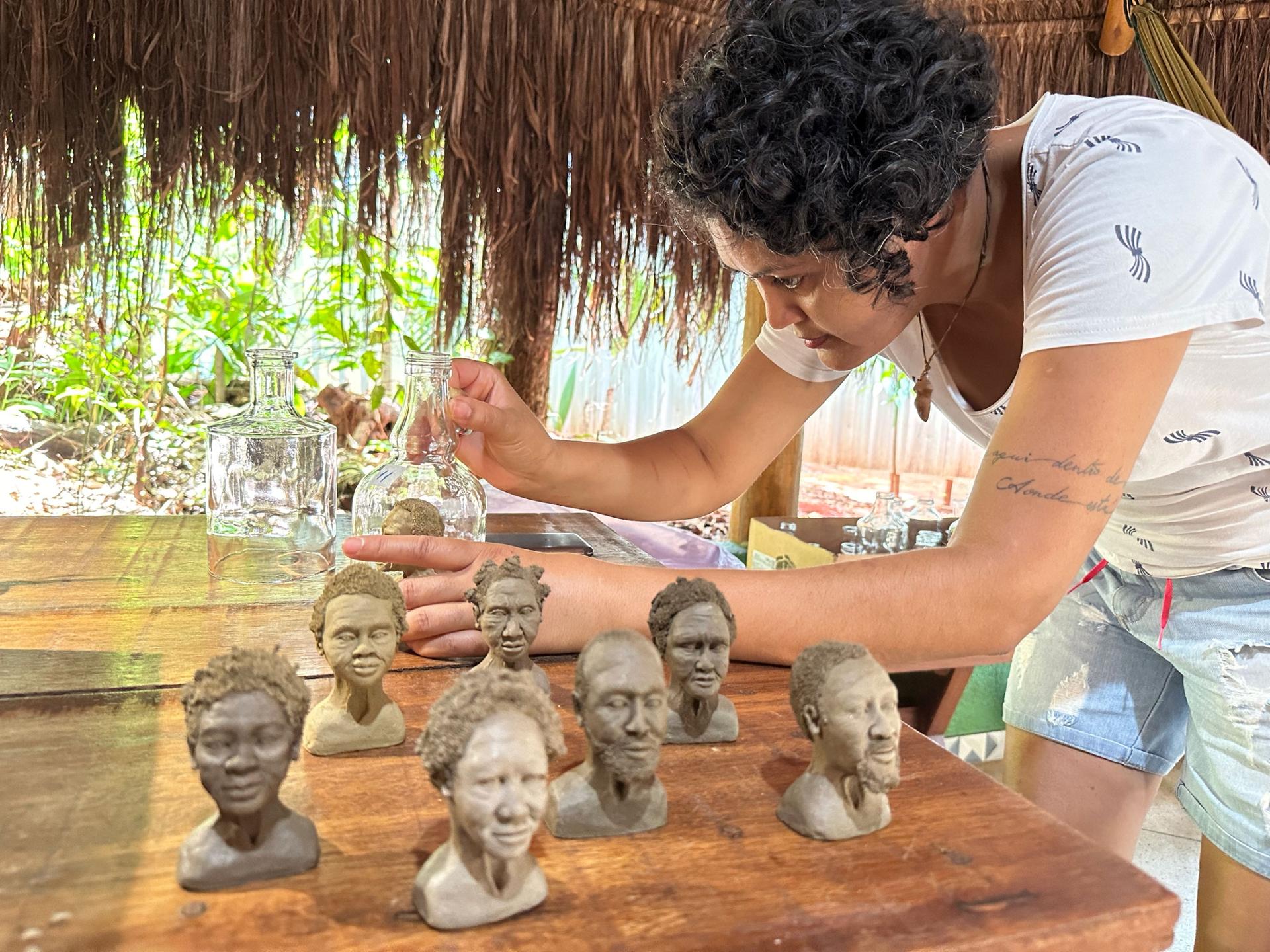 Lucelia Maciel is one of Dalton’s assistants and she also produces her own work, like these sculptures of lamps with tiny busts of people from her home state of Bahia.