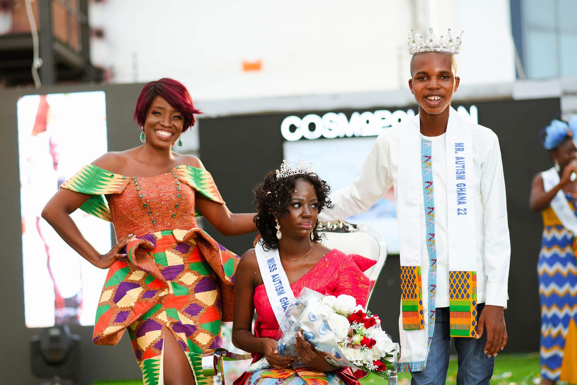 Afi Antonio (left) stands next to the winners of the 2022 Mr. and Miss Autism Ghana Pageant.