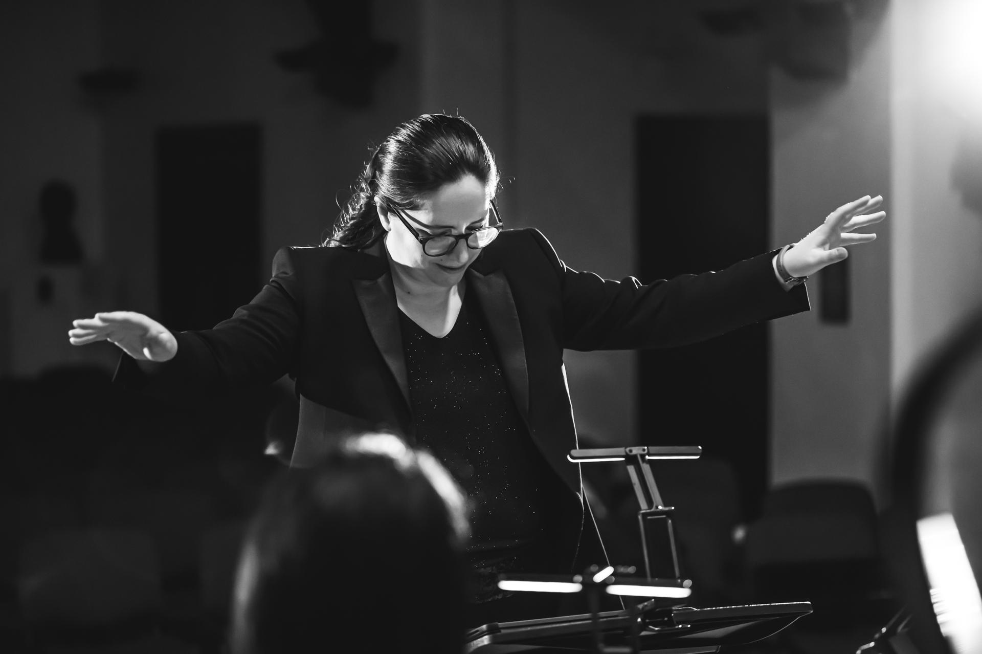woman conducting