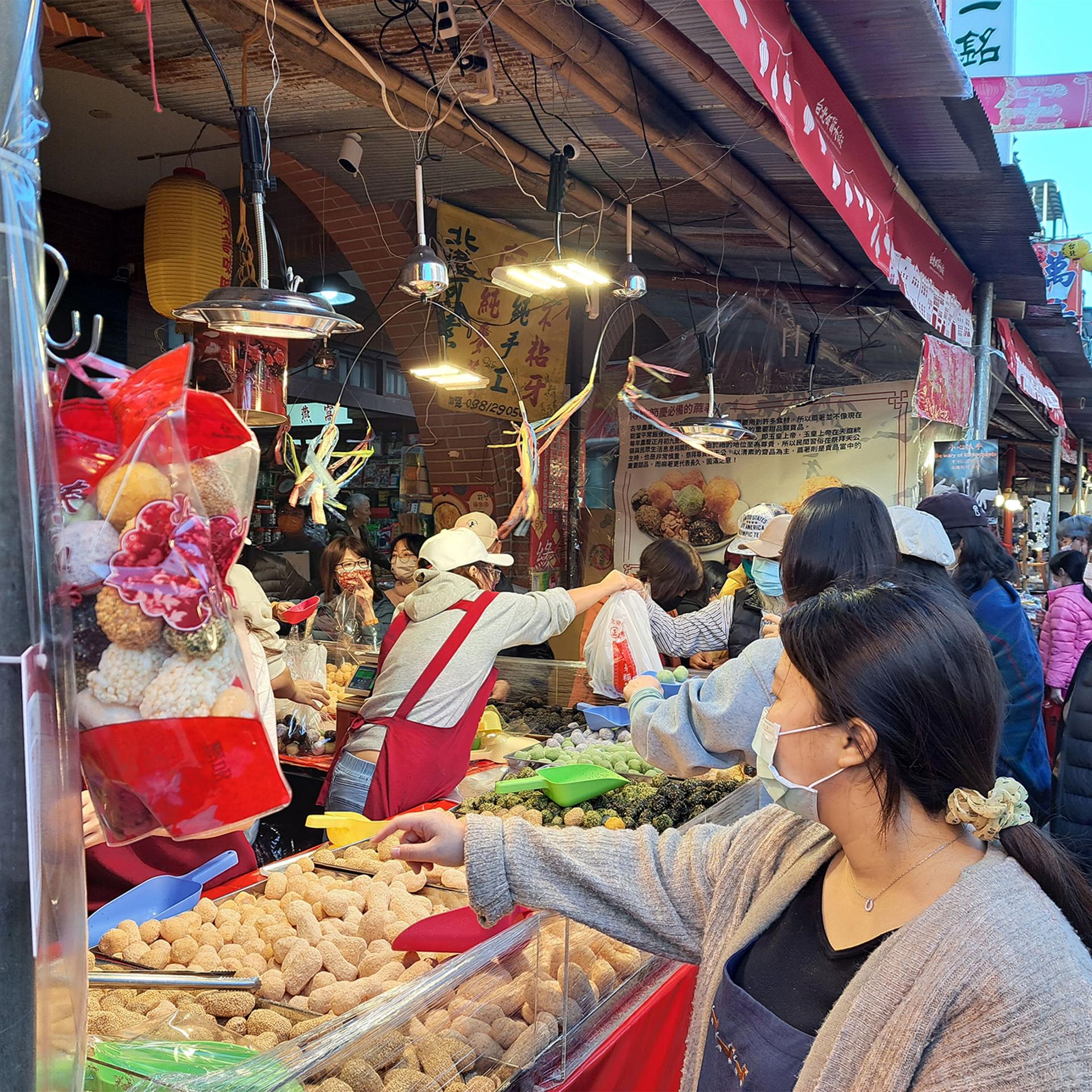 A woman shops ahead of Lunar New Year on Dihua Street in Taipei, Taiwan.