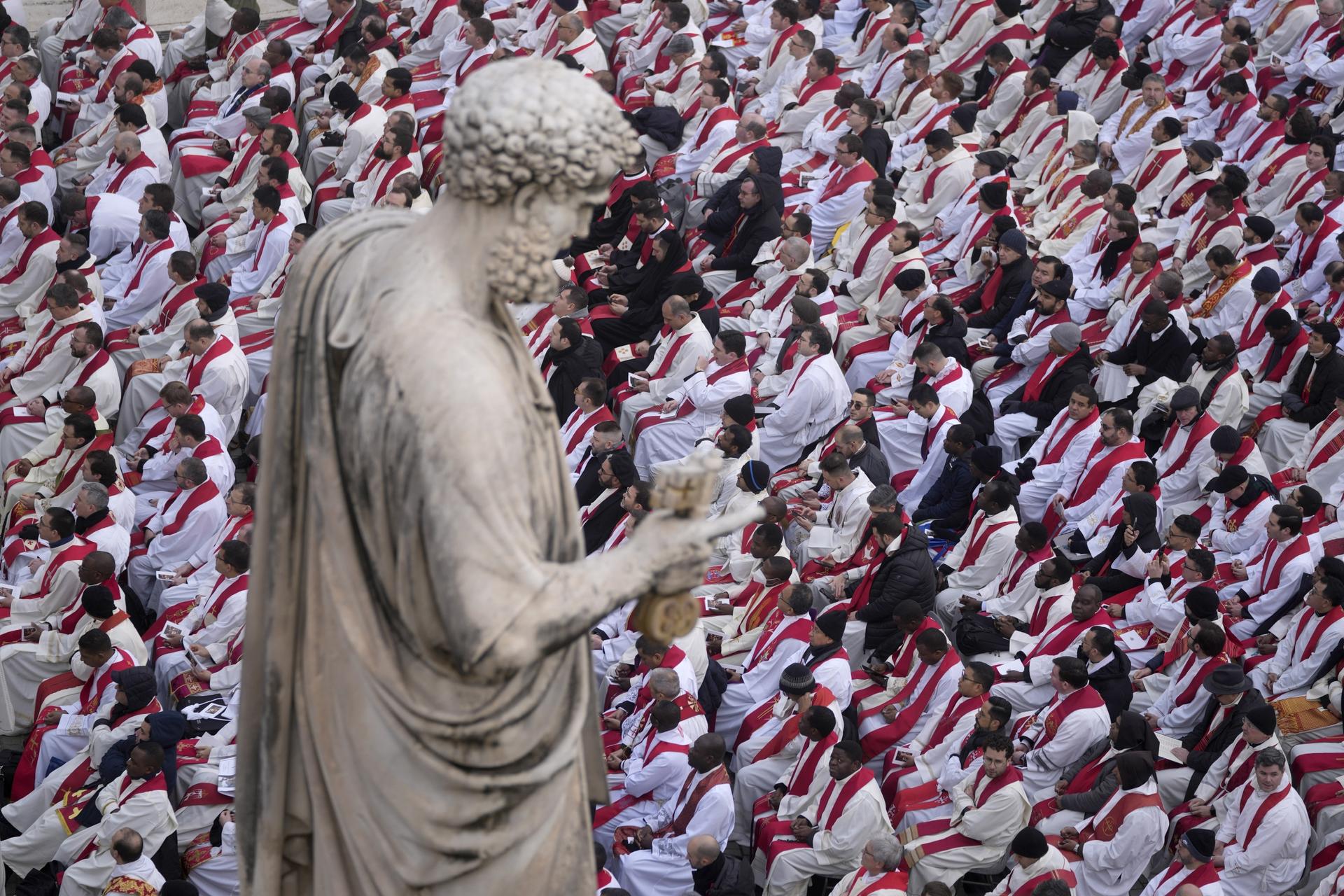 Faithful attend the funeral mass for late Pope Emeritus Benedict XVI in St. Peter's Square at the Vatican, Jan. 5, 2023.