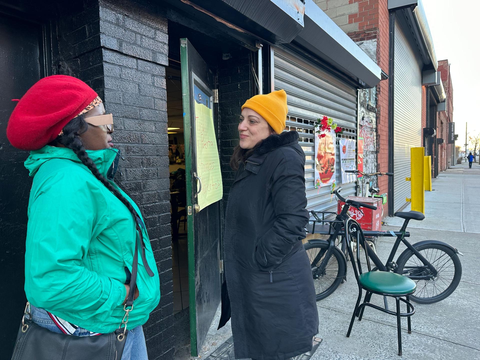 Louise Bauso (right) is an ESL teacher who runs Red Hook Mutual Aid, an organization of local volunteers who is providing assistance to the migrants who have been moved to the neighborhood.