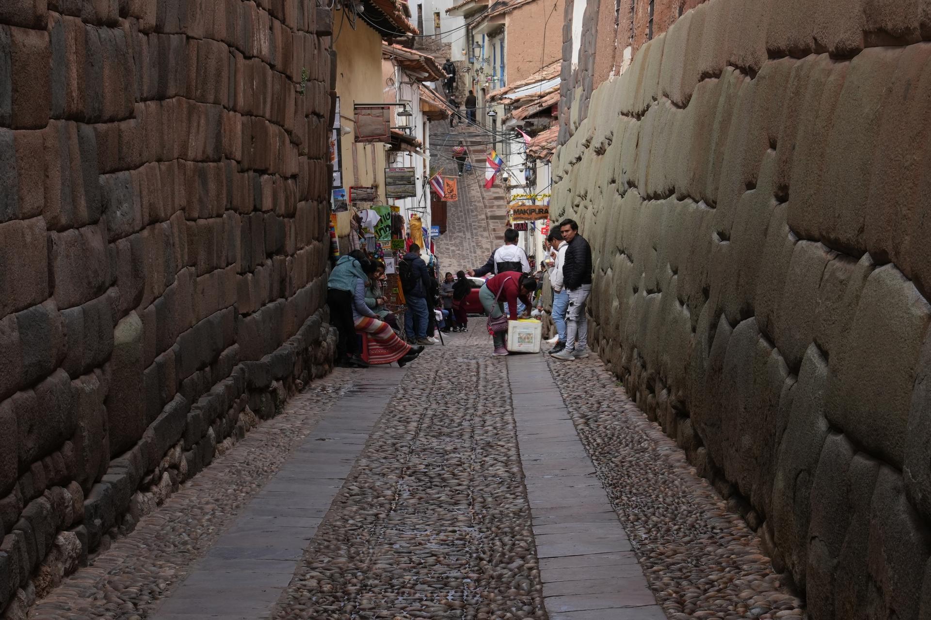 The streets in Cuzco are lined with walls that date back to the Inca empire.