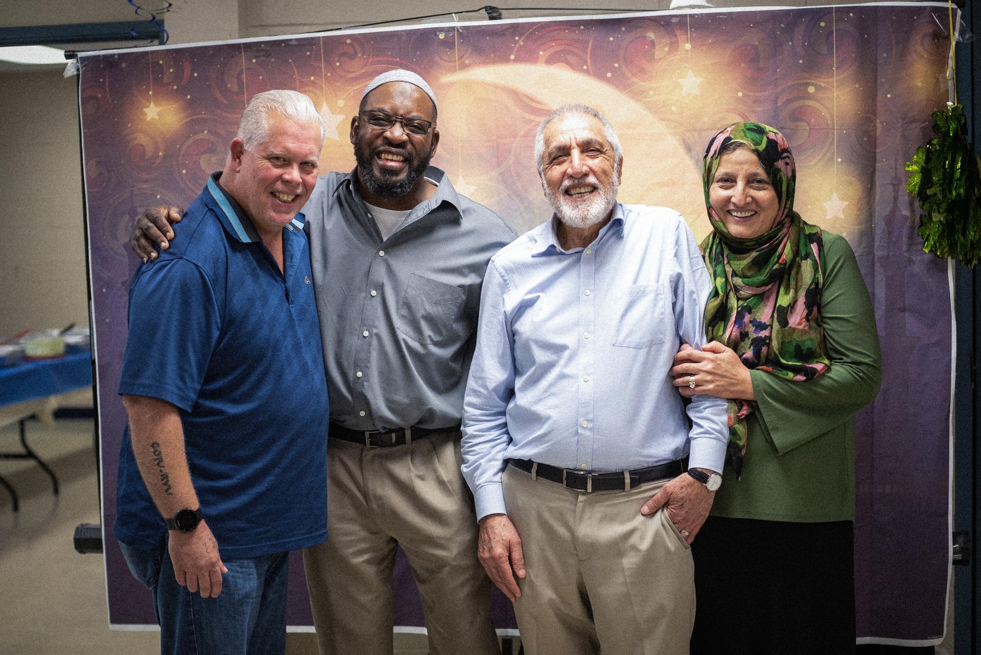 Richard “Mac” McKinney (left), Jomo Williams, Saber Bahrami and Bibi Bahrami pose together.