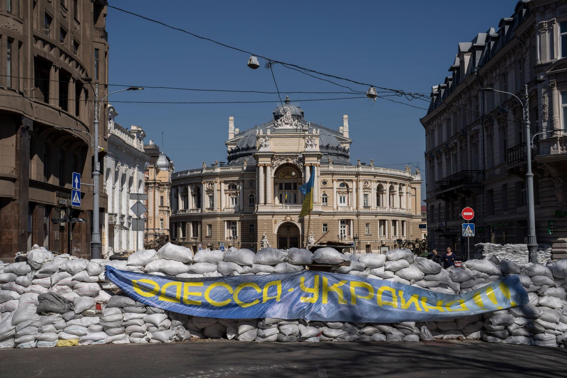 Sandbags block a street in front of the National Academic Theater of Opera and Ballet building as a preparation for a possible Russian offensive, in Odesa, Ukraine, Thursday, March 24, 2022. 