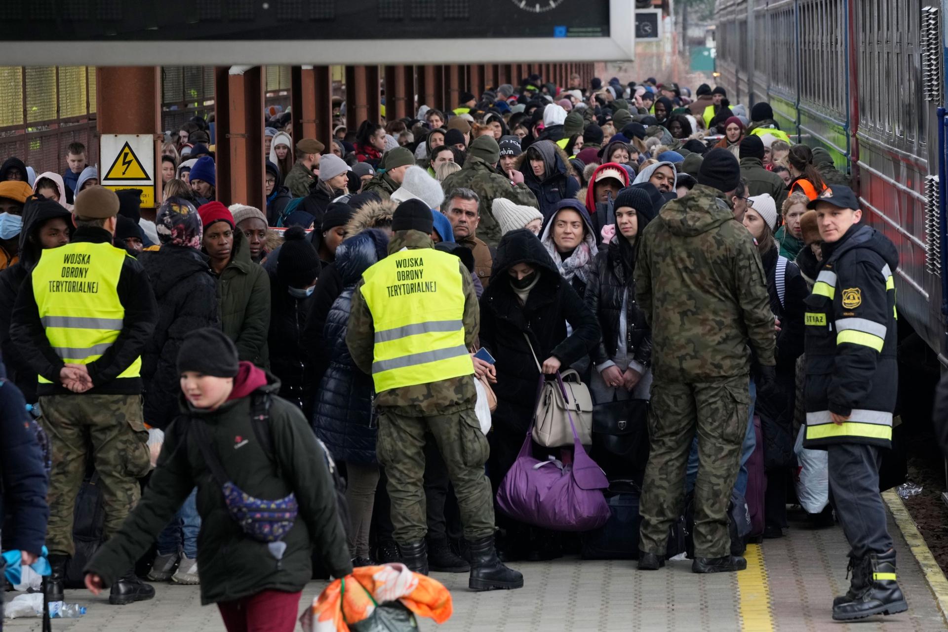 Refugees from Ukraine arrive at the railway station in Przemysl, Poland, Feb. 27, 2022. 