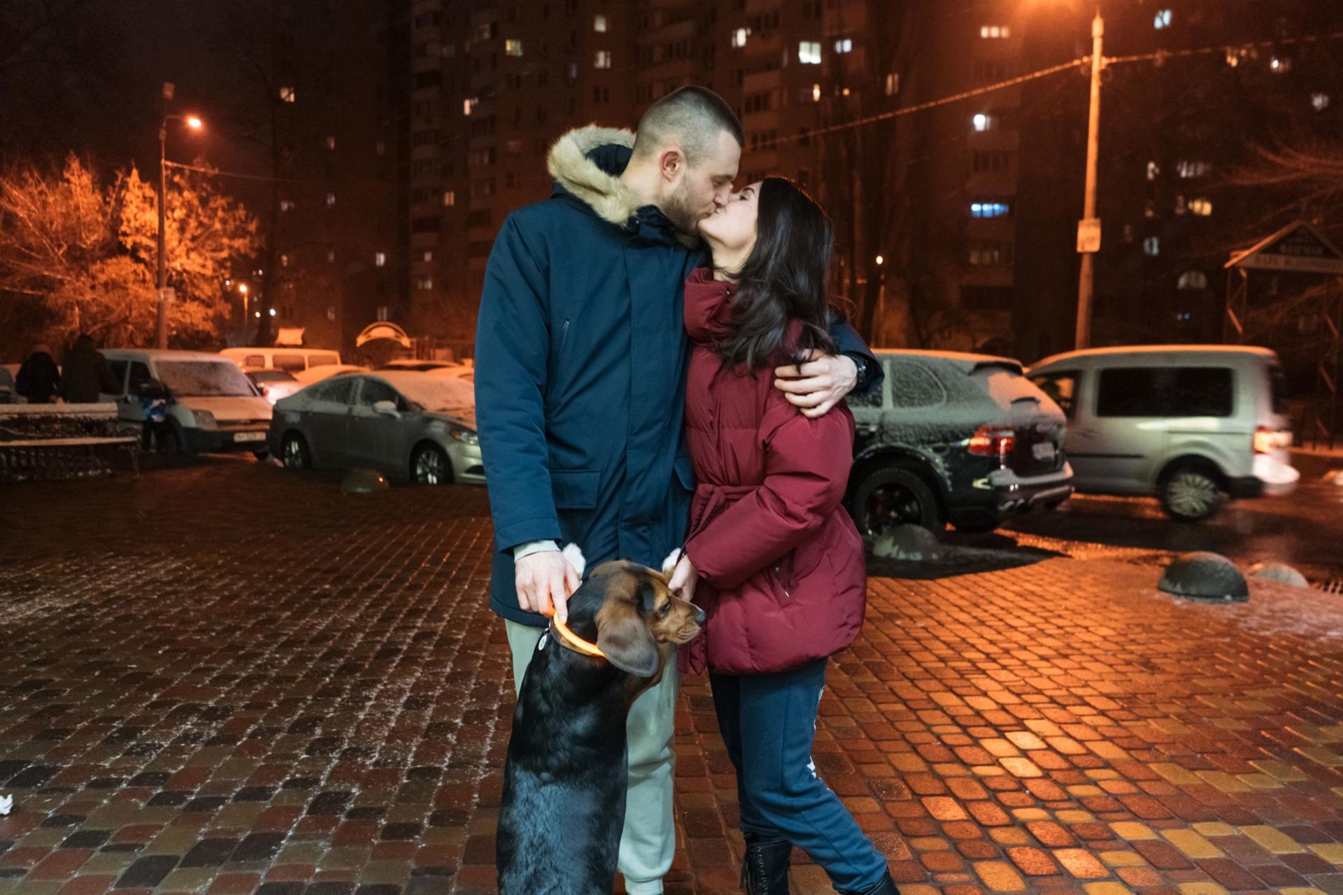 Alina Berezova and Stanislav Linevych and their dog in Kyiv. 