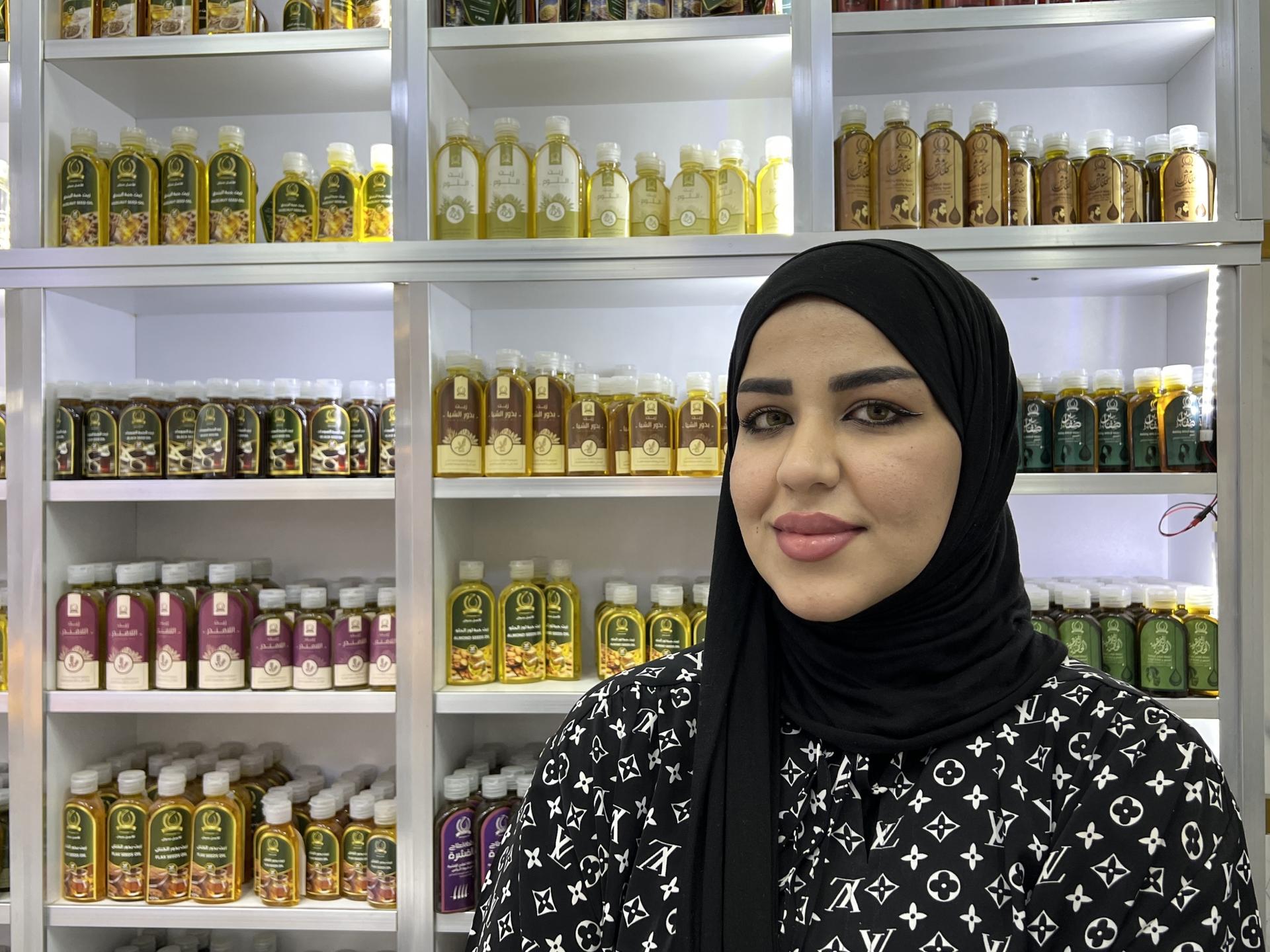 Nada Al Quraishi, 23, works as a cashier at a natural hair products store in Baghdad.