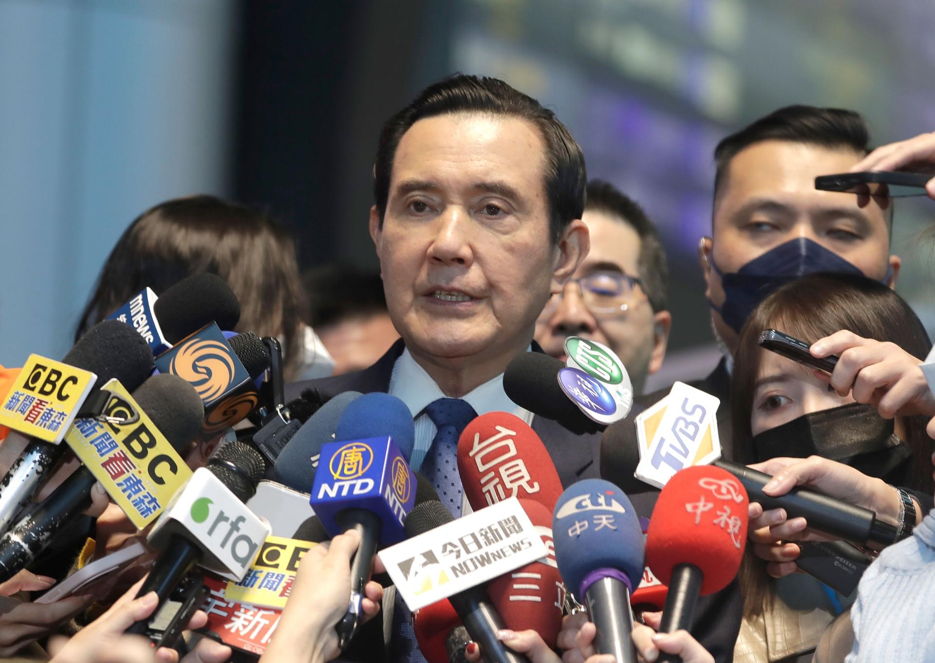 Former Taiwan President Ma Ying-jeou answers to press before leaving for China at Taoyuan International Airport in Taoyuan City, Northern Taiwan, Monday, March 27, 2023. 