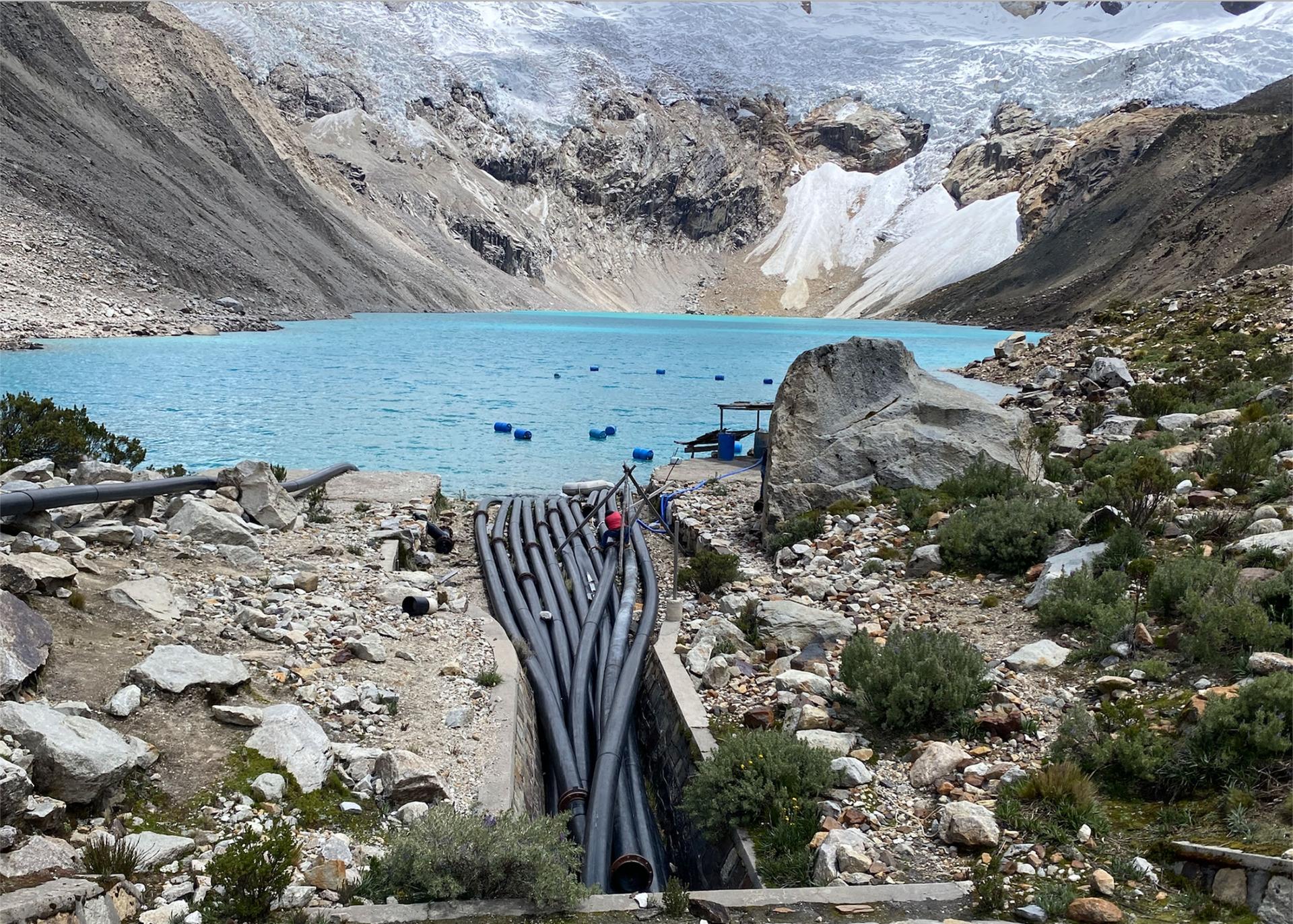 Plastic tubes siphon water out of Lake Palcacocha in Peru to keep its levels in check.