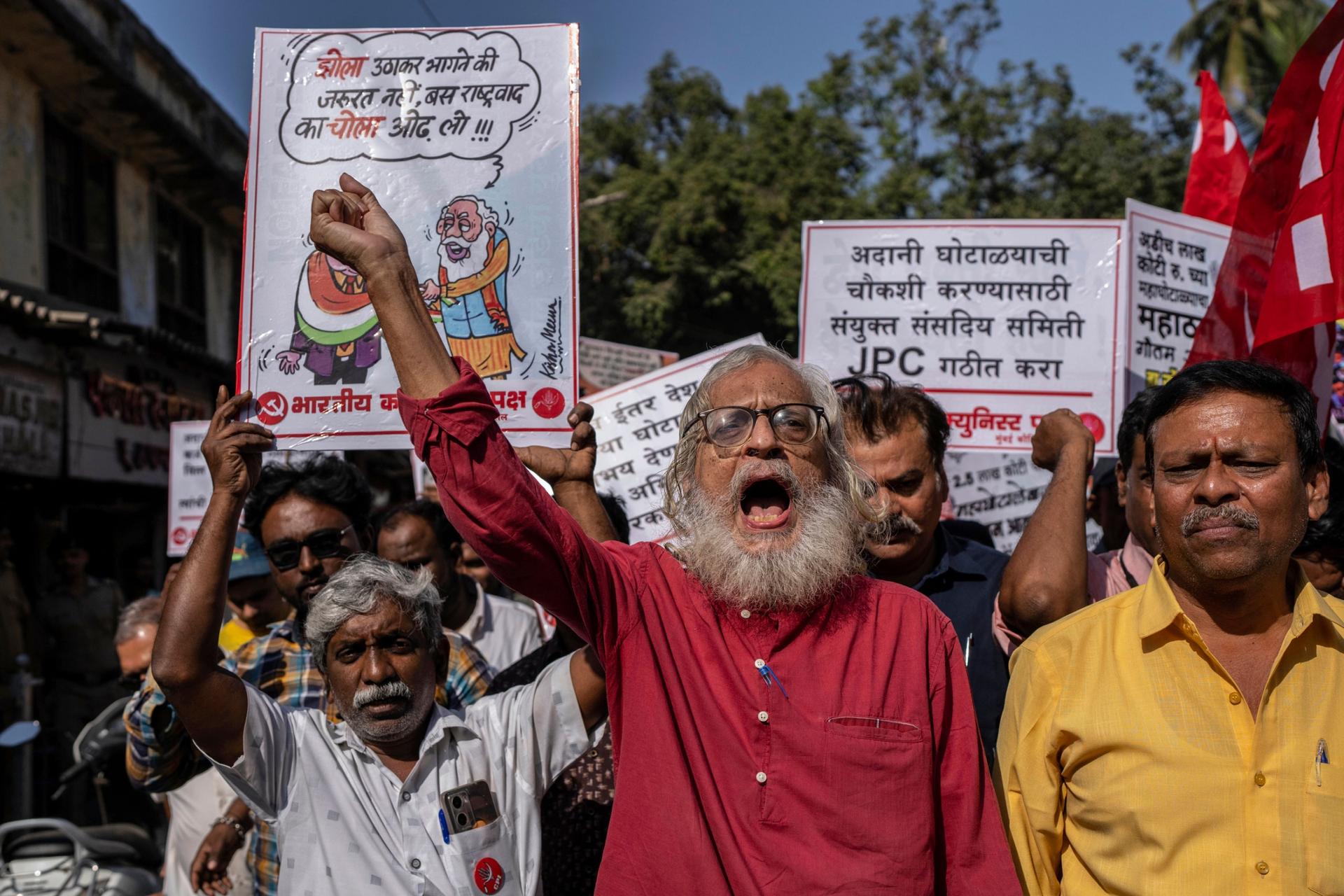 Activists of Communist Party of India shout slogans as they demand regulators investigate allegations of fraud and stock manipulation by India's Adani group in Mumbai, India, Monday, Feb. 13, 2023. 
