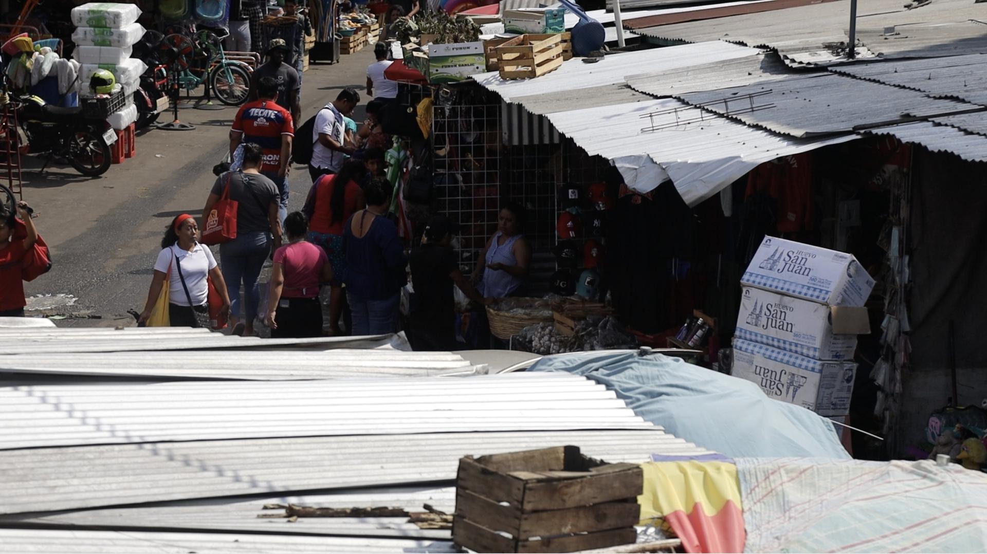 View of various people shopping at a street market in Tapachula, Mexico