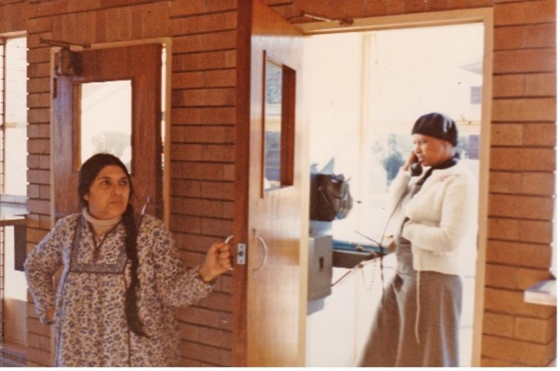 Winnie in Brandfort with Fatima Meer talking on the phone at a post office