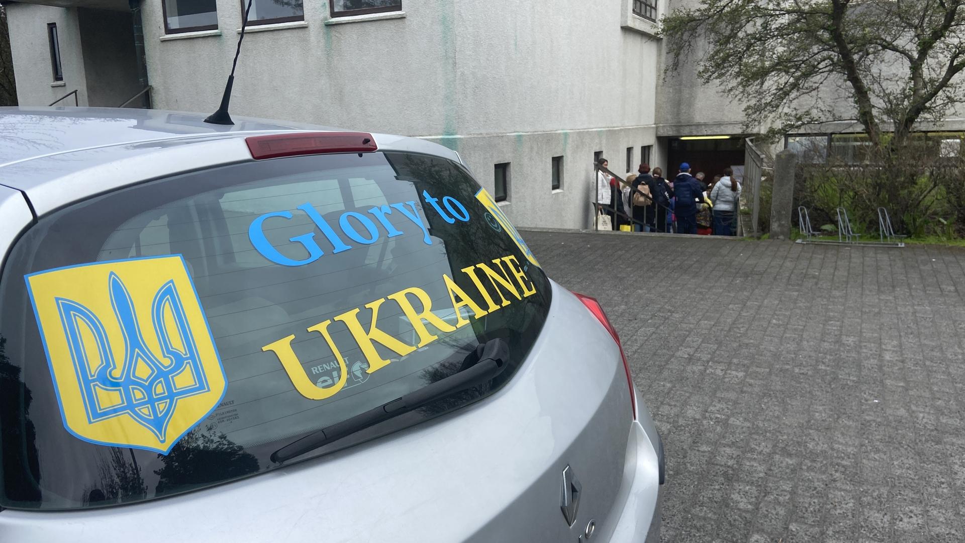 a car displaying a pro-Ukraine sticker