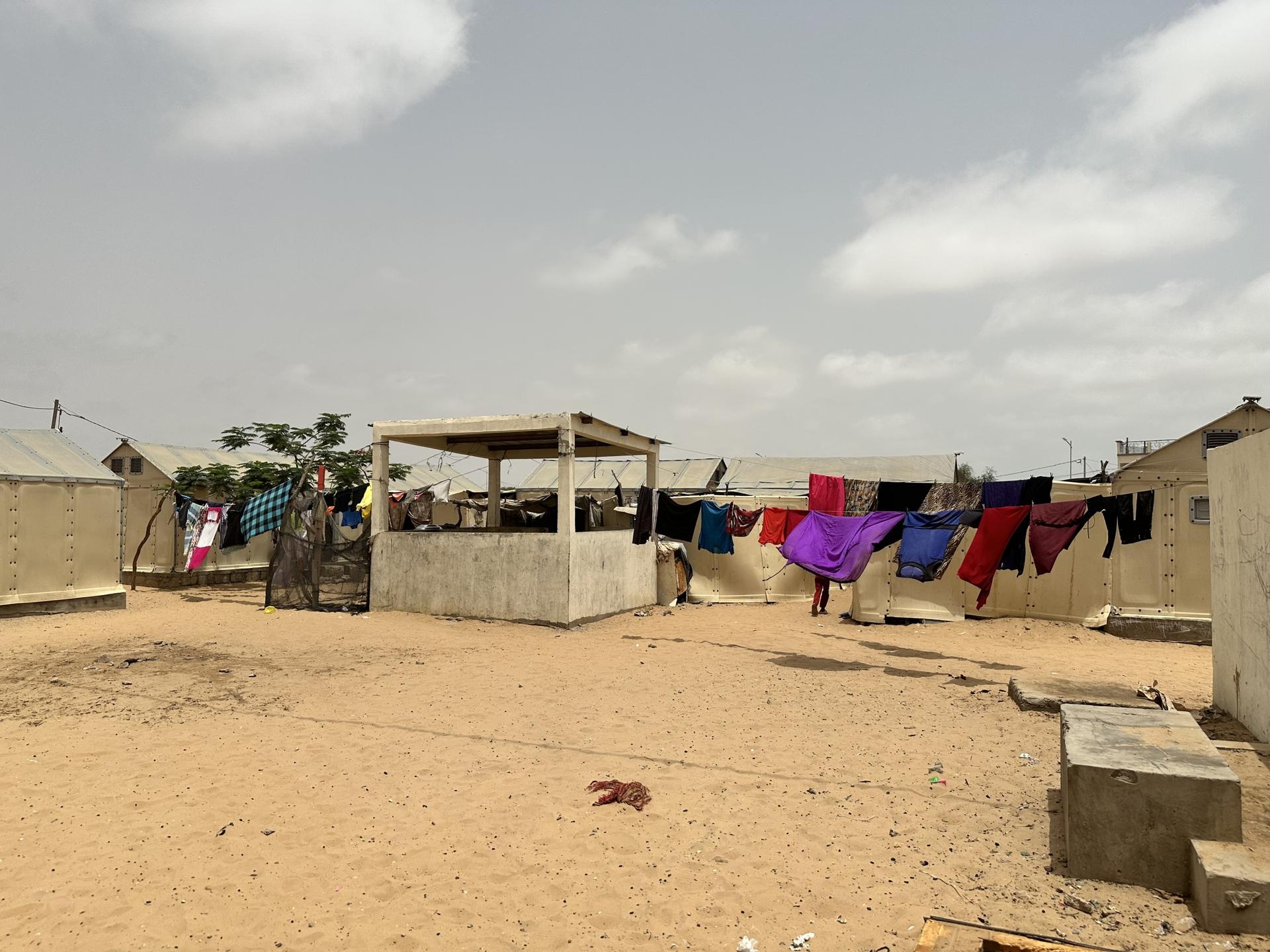 The Diougop camp, where some 1,500 people were displaced by sea level rise, is surrounded by sand.