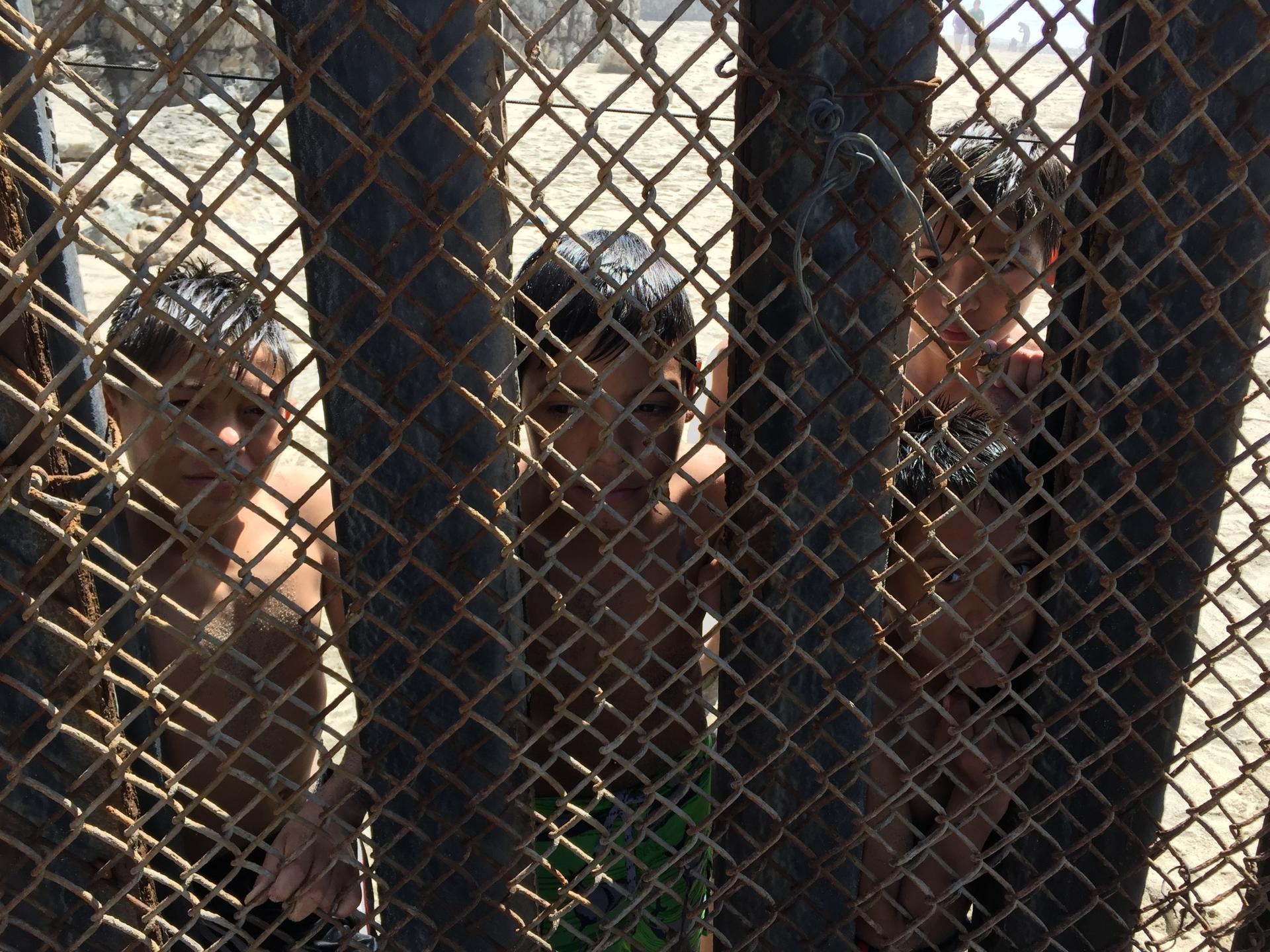 children behind fence
