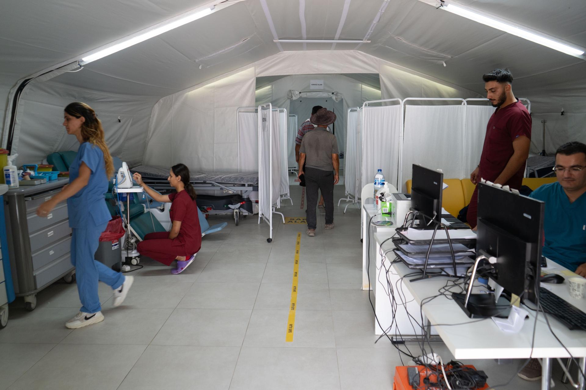 A tent hospital set up on Samandağ beach, not far from a large dump site for earthquake debris.