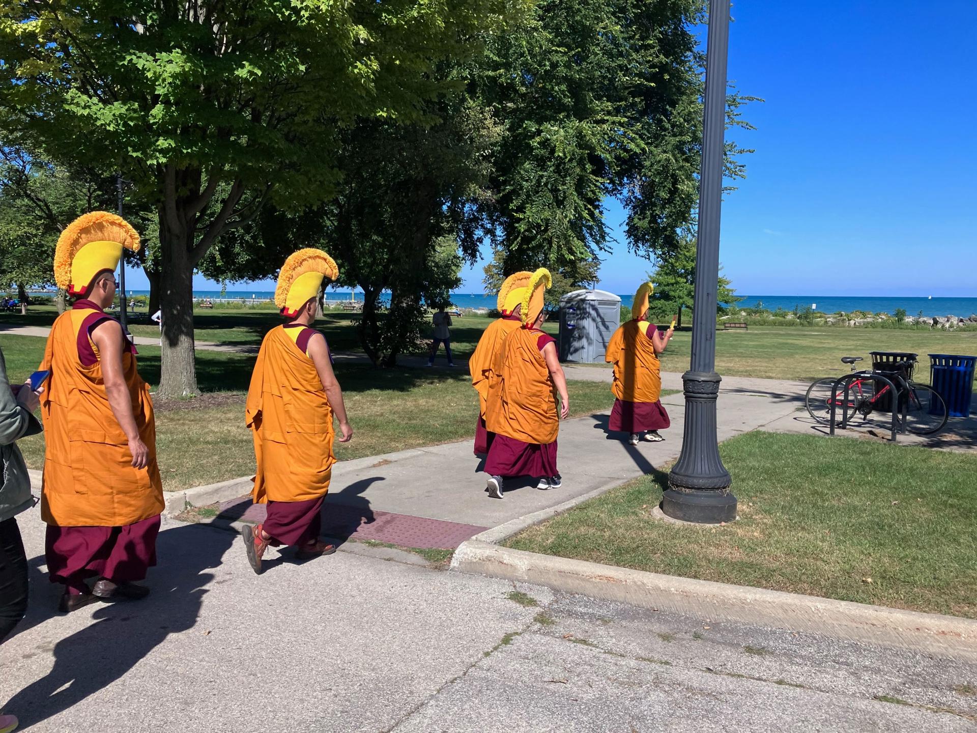 The monks chant as they make their procession to Lake Michigan, to release the sacred sand into the water. 
