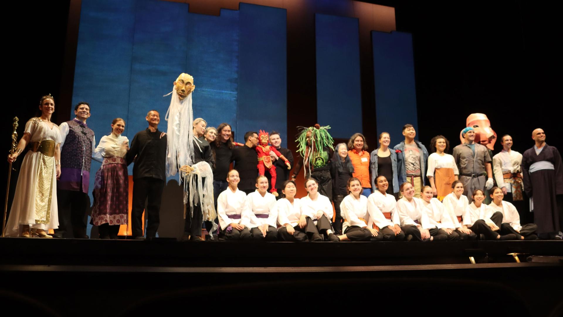 The cast and creative team of “Monkey: A Kung Fu Puppet Parable,” including the Voices Boston children's choir, after a rehearsal at the Emerson Paramount Center in Boston, Sept. 20, 2023.