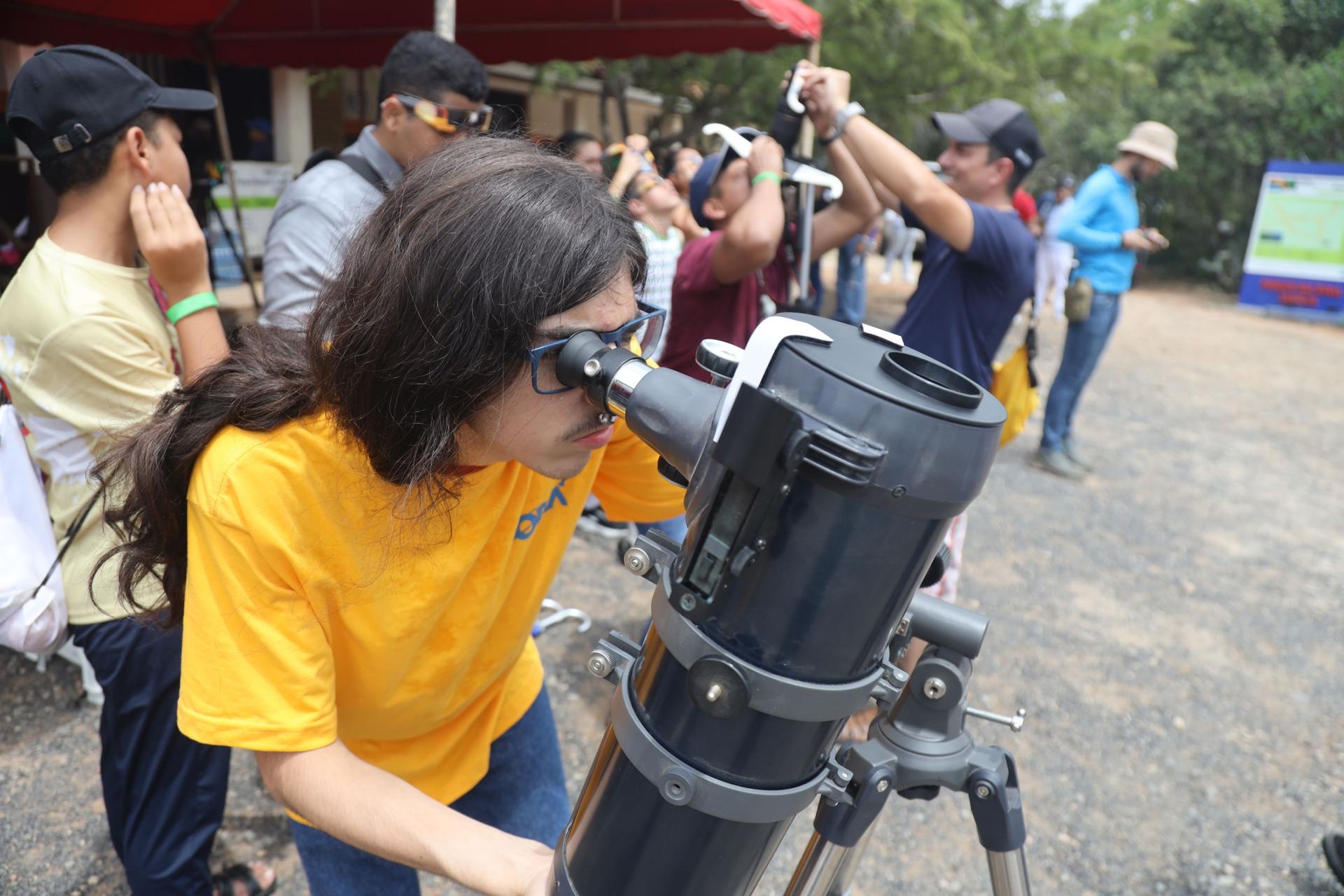Hugo Fares, 17, takes a look into the telescope. 