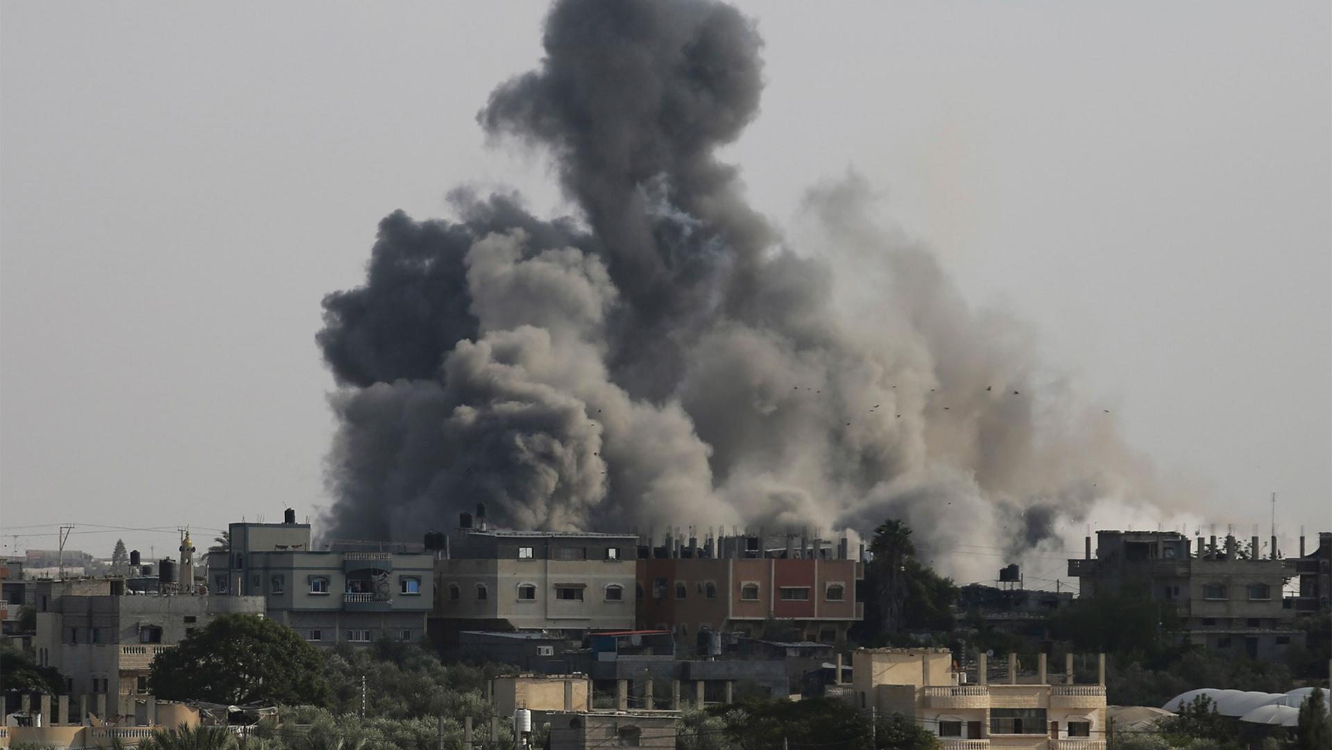 Smoke rises from an explosion caused by Israeli airstrikes on the border between Egypt and Rafah, Gaza Strip, Oct. 10, 2023.