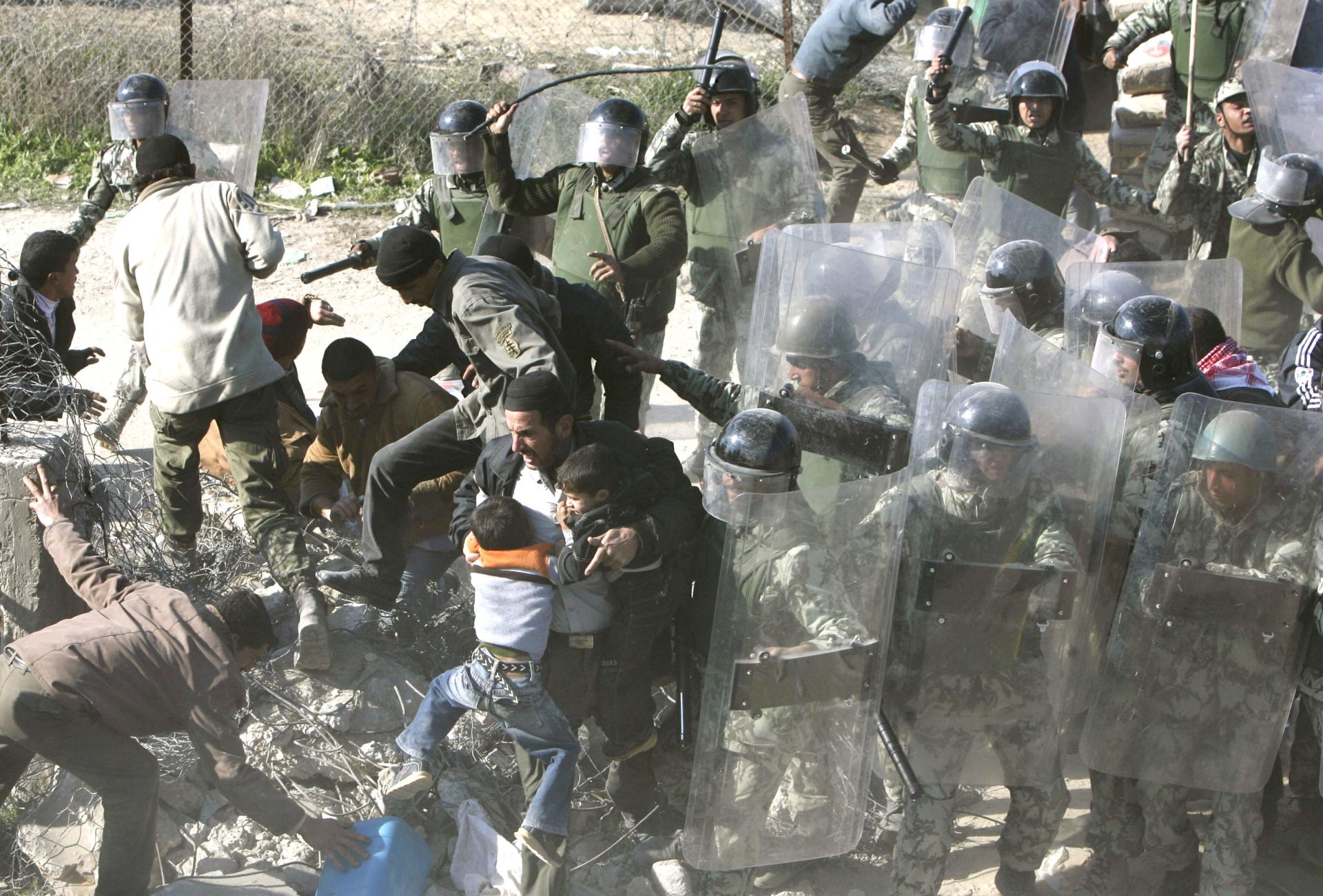 Egyptian border guards clash with Palestinians attempting to cross from Gaza into Rafah, Egypt, Jan. 25, 2008.