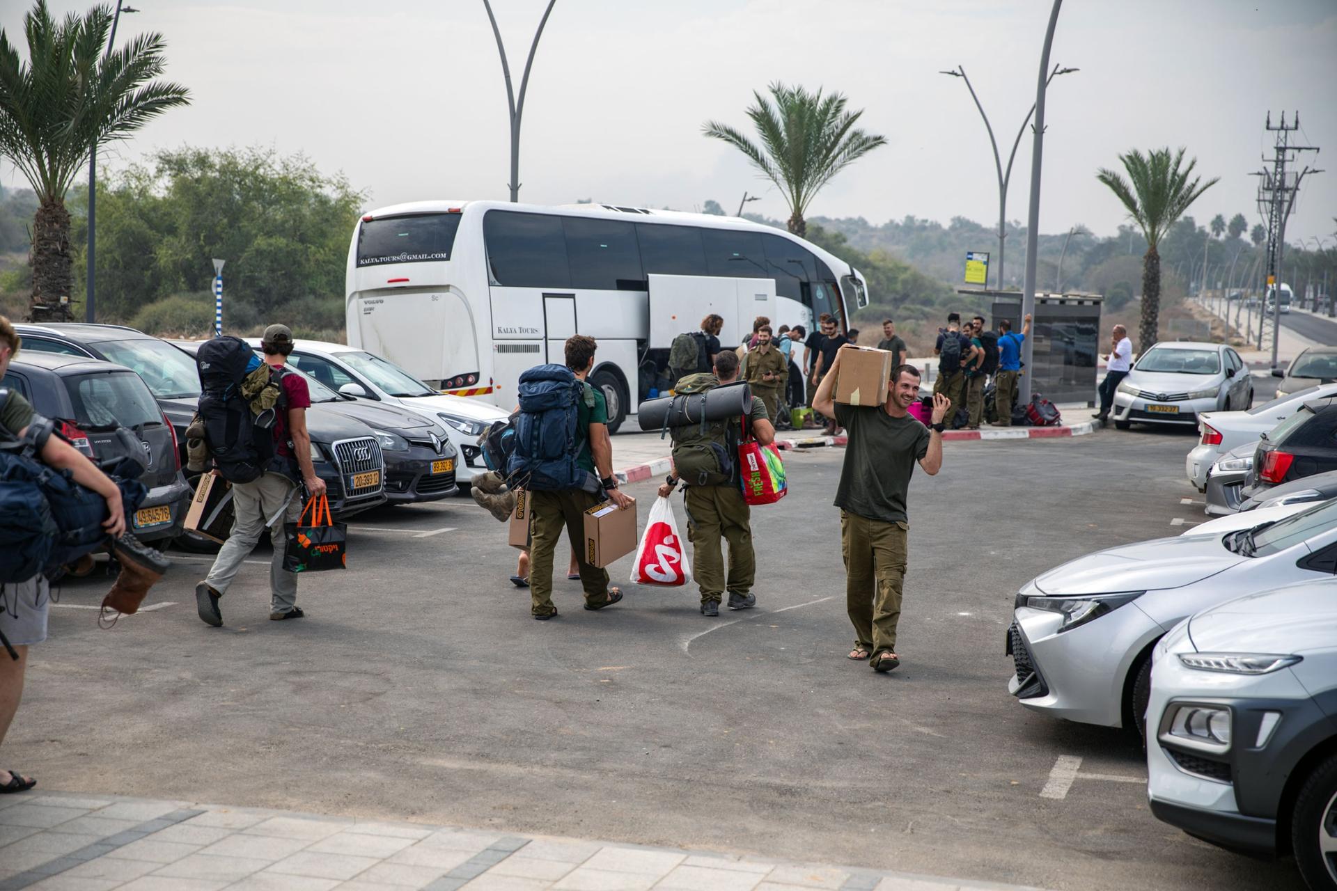 On the edge of Ashkelon, buses and green Israeli army vehicles were dropping off uniformed soldiers who’ve been fighting inside of the Gaza Strip.
