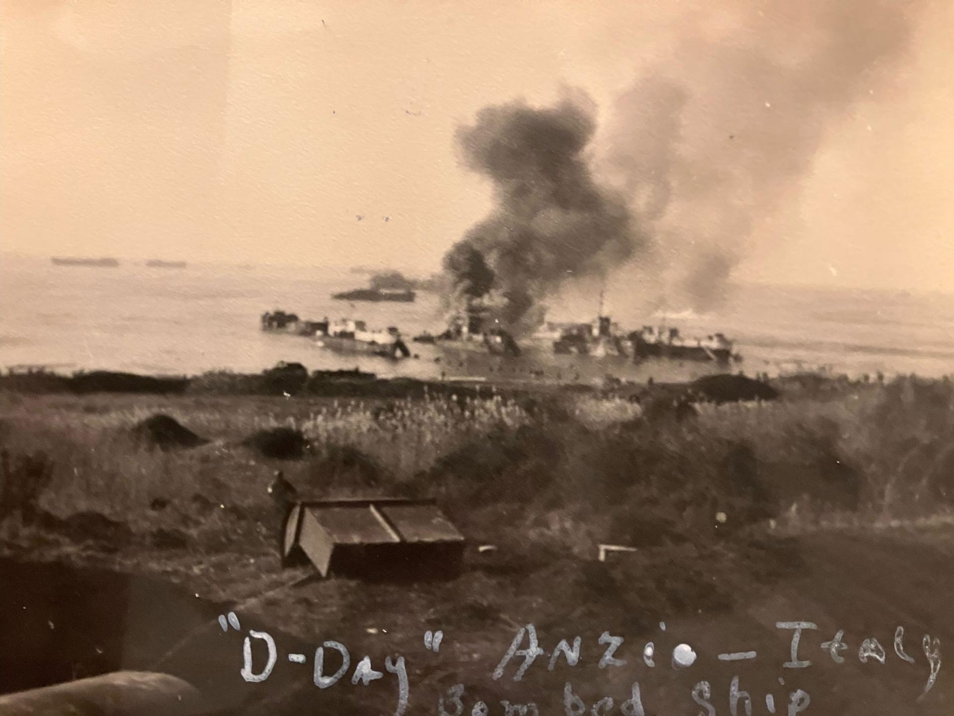 A landing ship tank is hit by a fighter bomber, Anzio, Italy. 