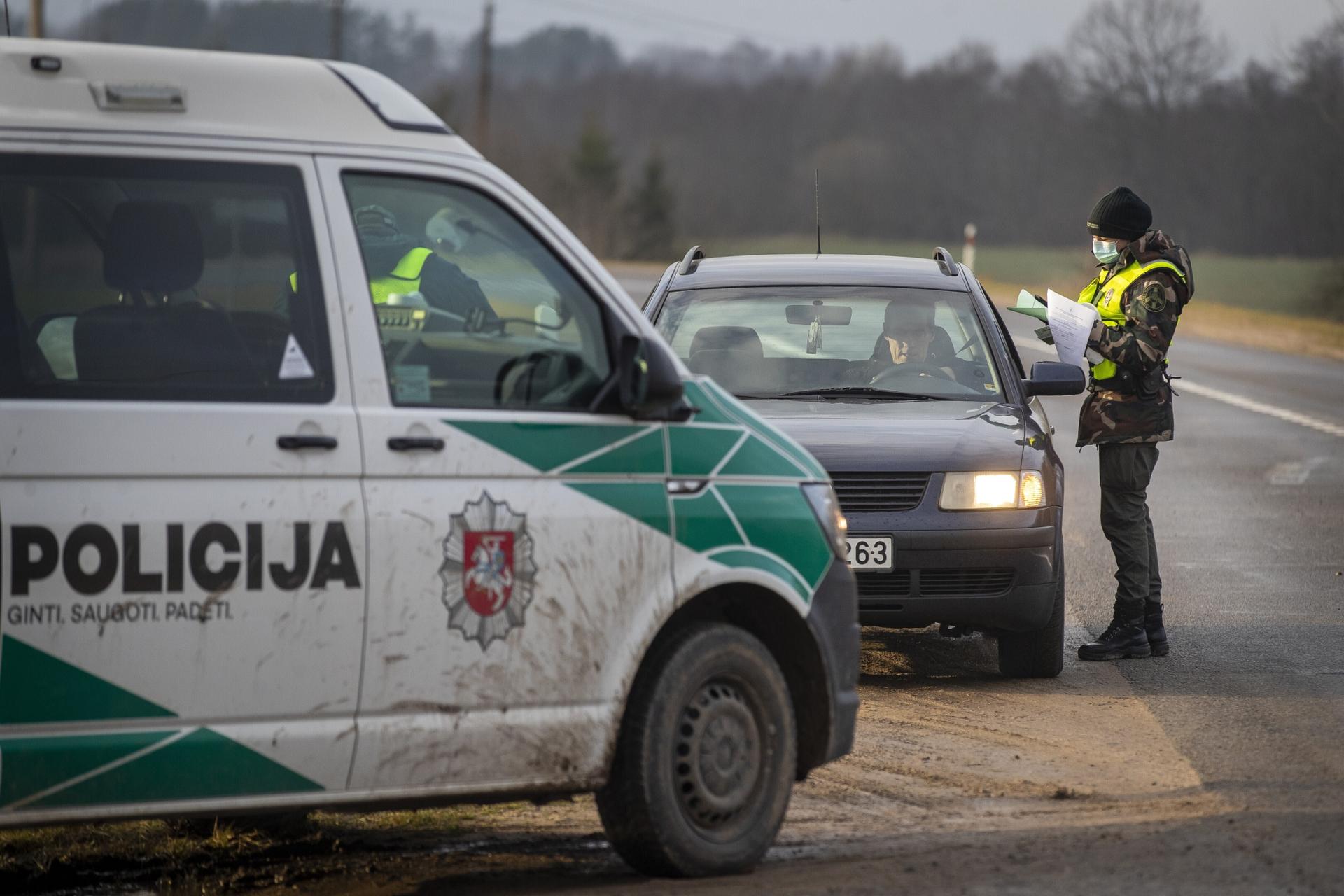 Members of the Lithuania State Border Guard Service and police check vehicle near Lithuania-Belarus border in a village Kacergiske, northeast of the capital Vilnius, Lithuania, Wednesday, Nov. 10, 2021. 