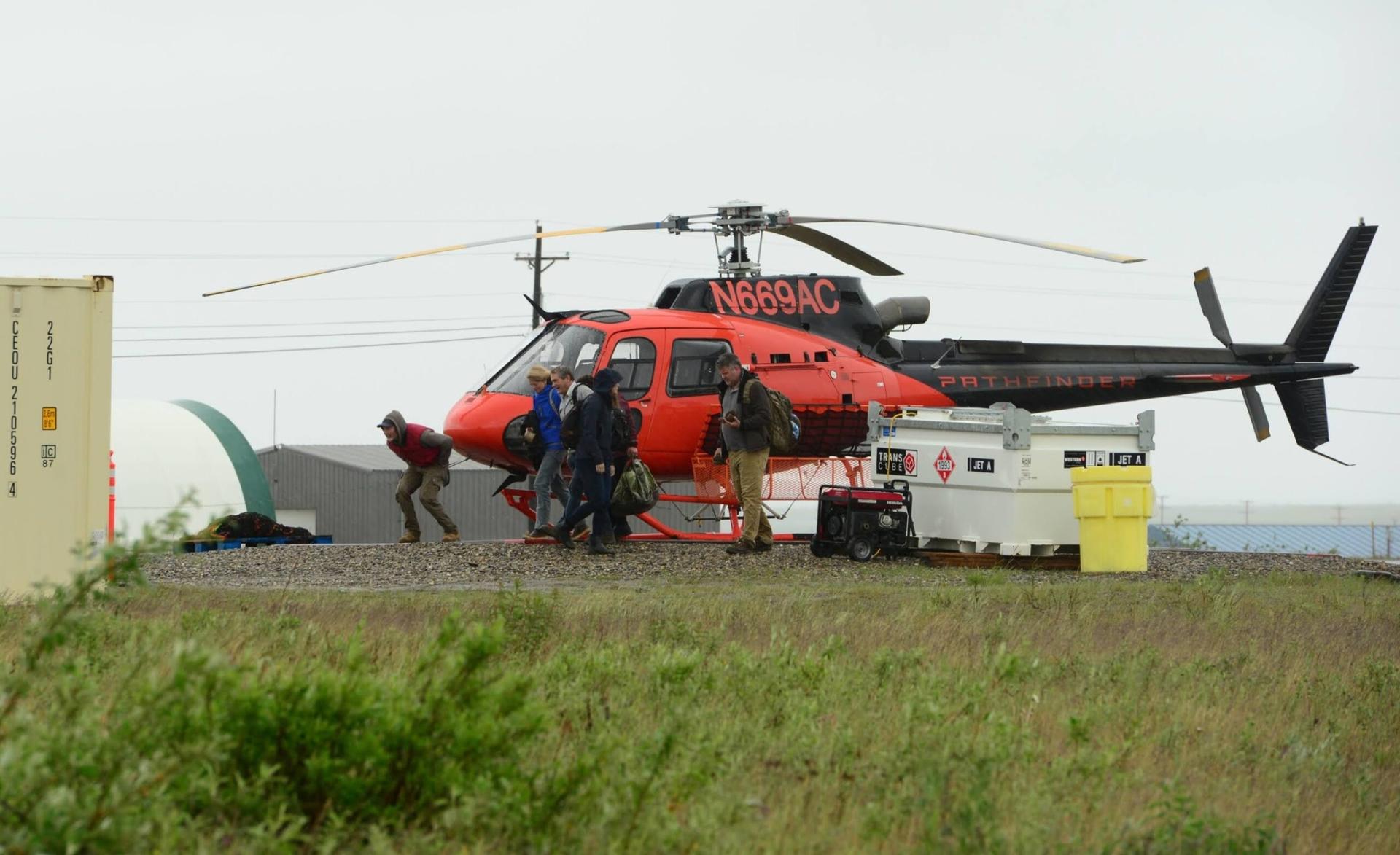  U.S. Sen. Lisa Murkowski walks away from a helicopter that flew her to the Graphite One project, a mining exploration camp that the Canadian company is developing to build an open pit graphite mine.