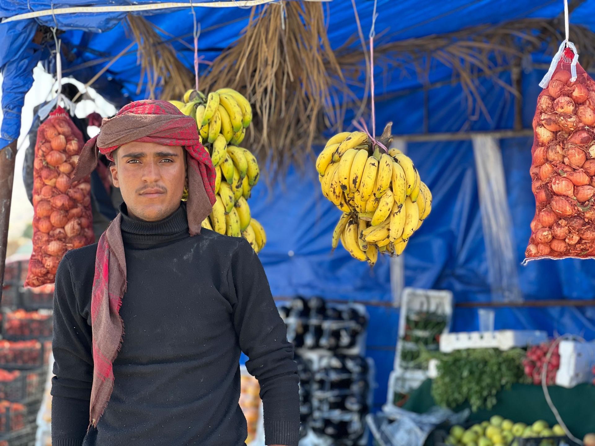 Mabrouk Abdullah, 21, is from Yemen. He sells fruits by the side of the road in the Jordan Valley.