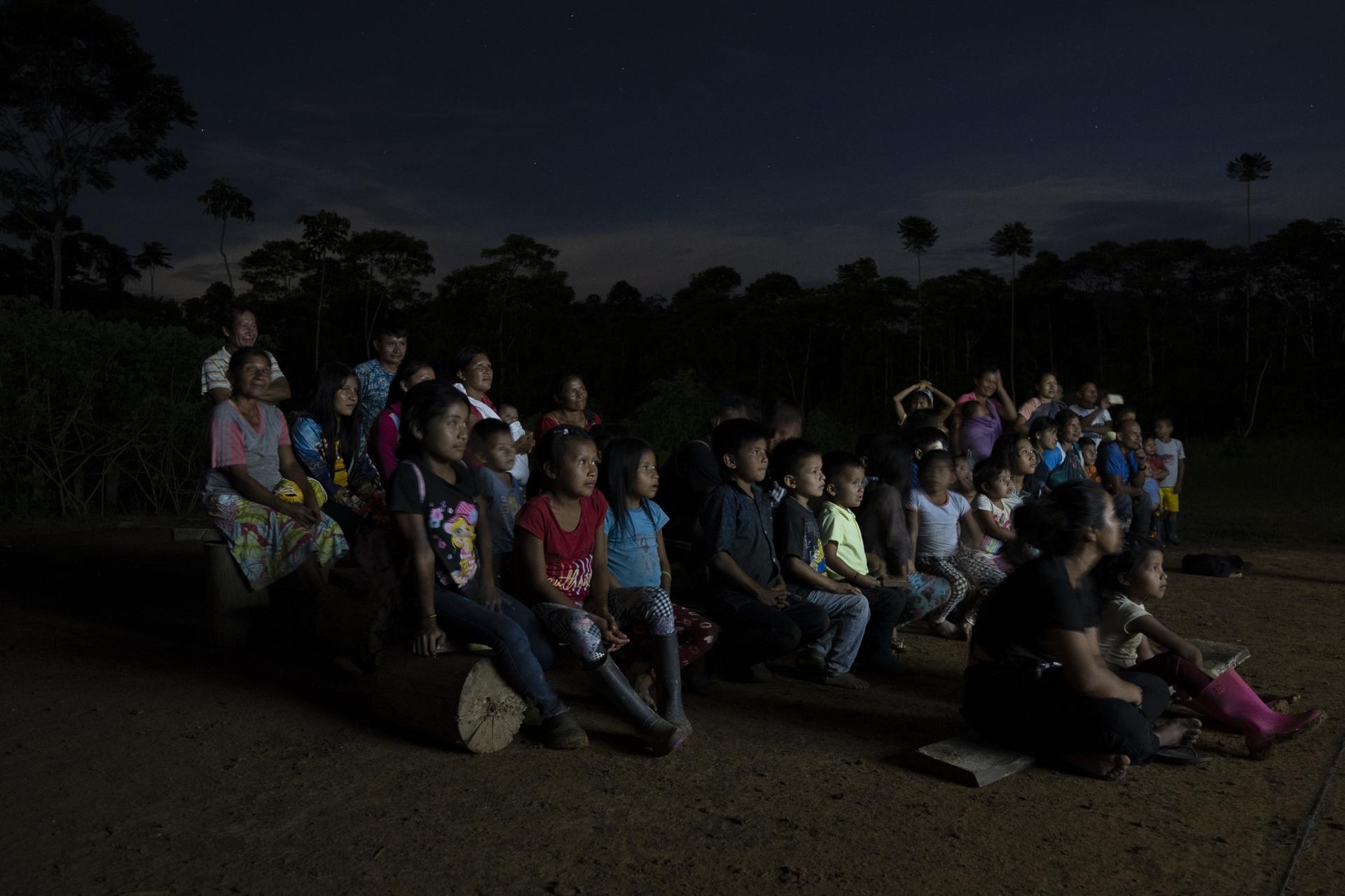 Crowds of people from Indigenous communities gather to watch films during the Kanua film festival in Ecuador.