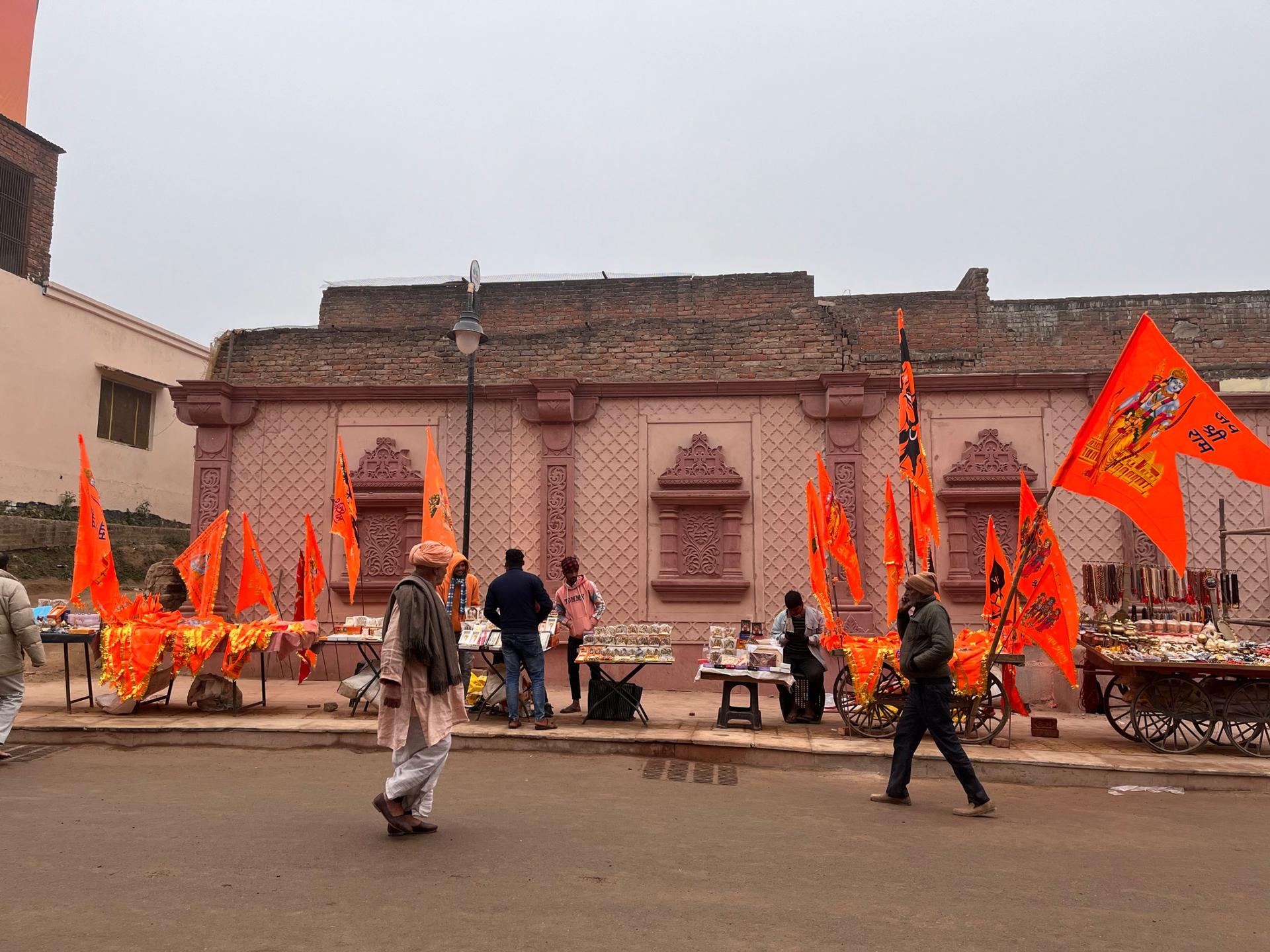 Hindu pilgrims walk on a newly-constructed boulevard in Ayodhya, northern India, that leads to a grand temple dedicated to the Hindu god Ram.
