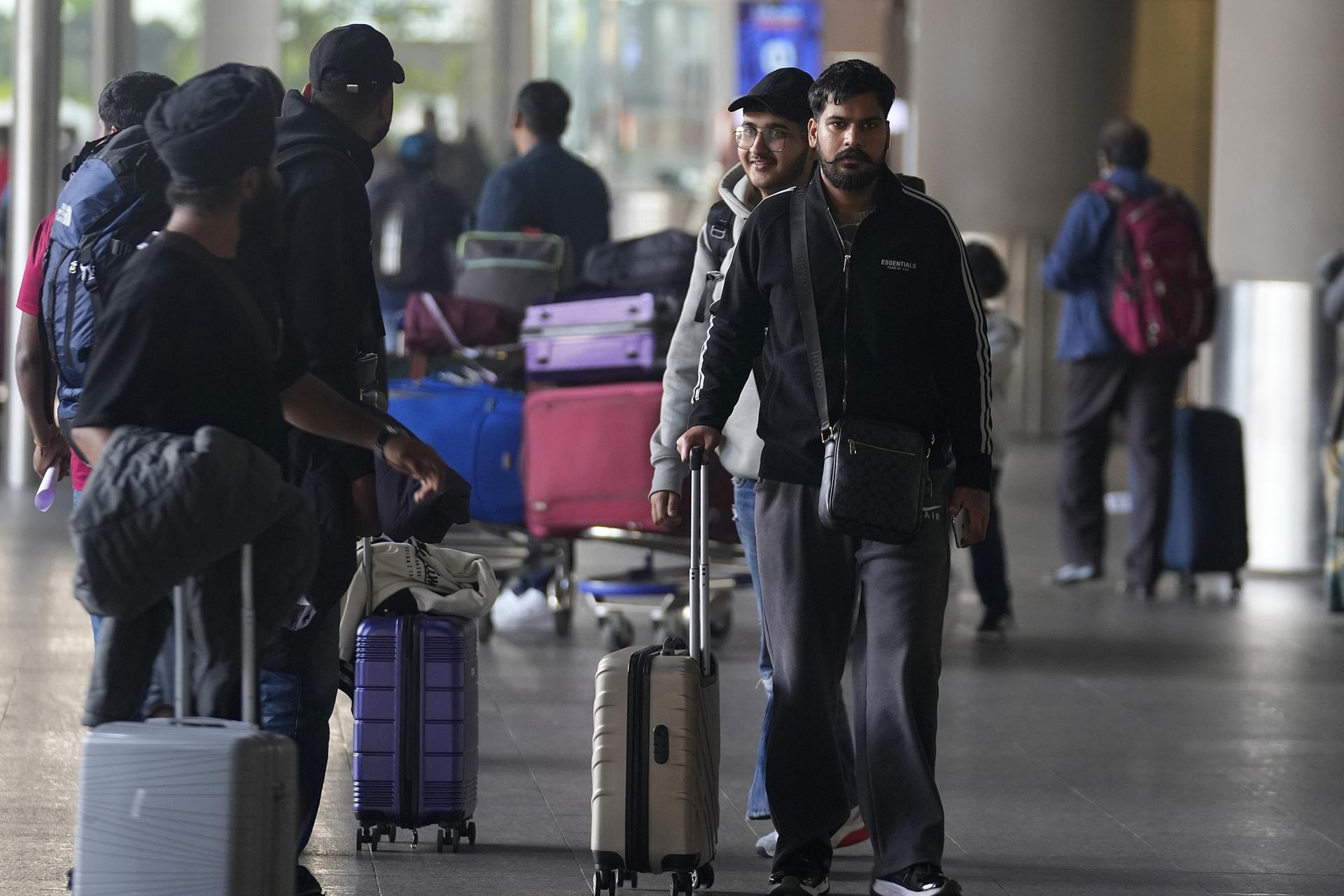 Indian passengers who travelled in an unmarked Legend Airlines A340 from Vatry Airport in France, arrive at the Chhatrapati Shivaji Maharaj International Airport in Mumbai, India, Dec. 26, 2023.