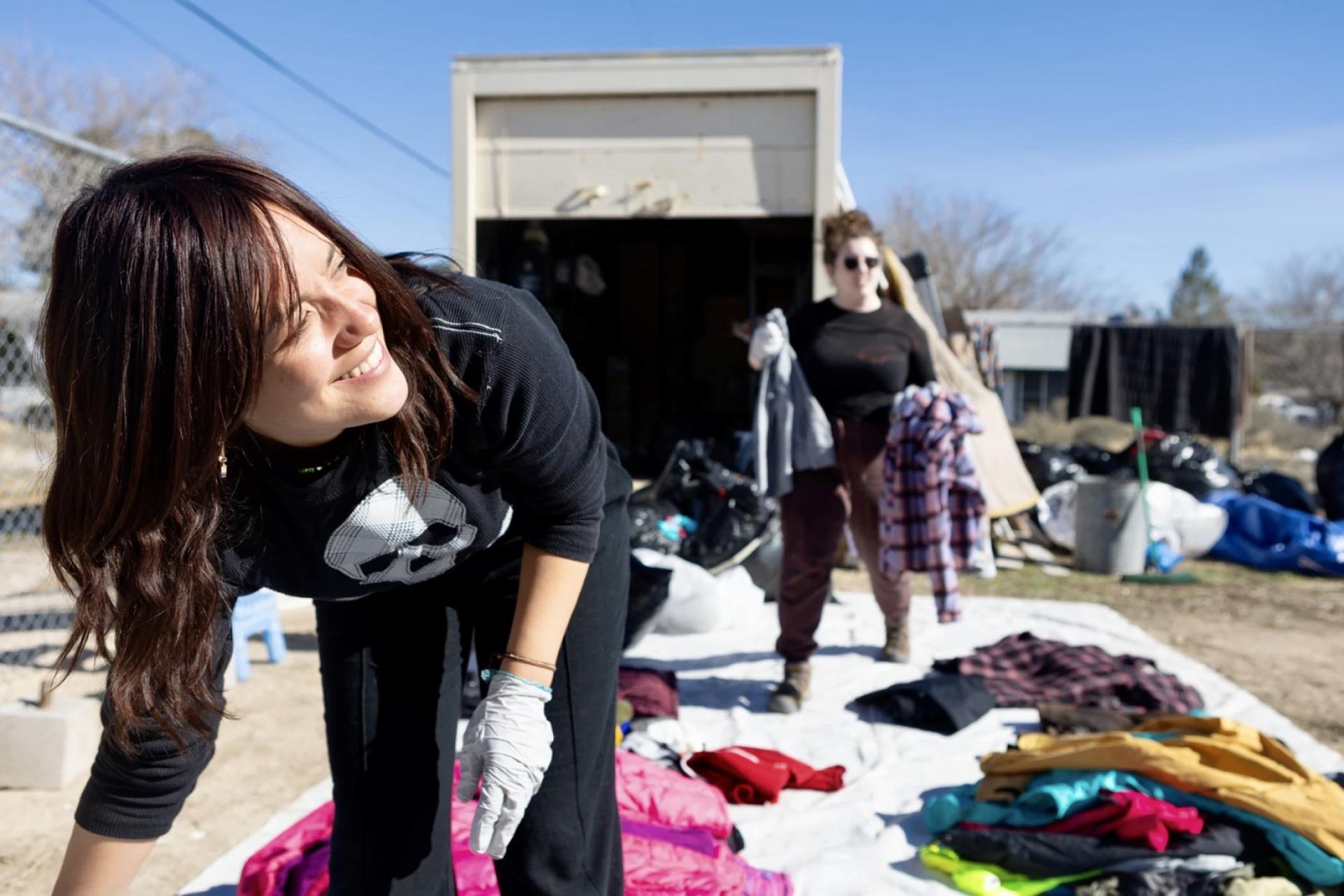 Catalina Torres, who works with Al Otro Lado to deliver aid to migrants, organizes donated clothing at the Youth Center in Jacumba Hot Springs.